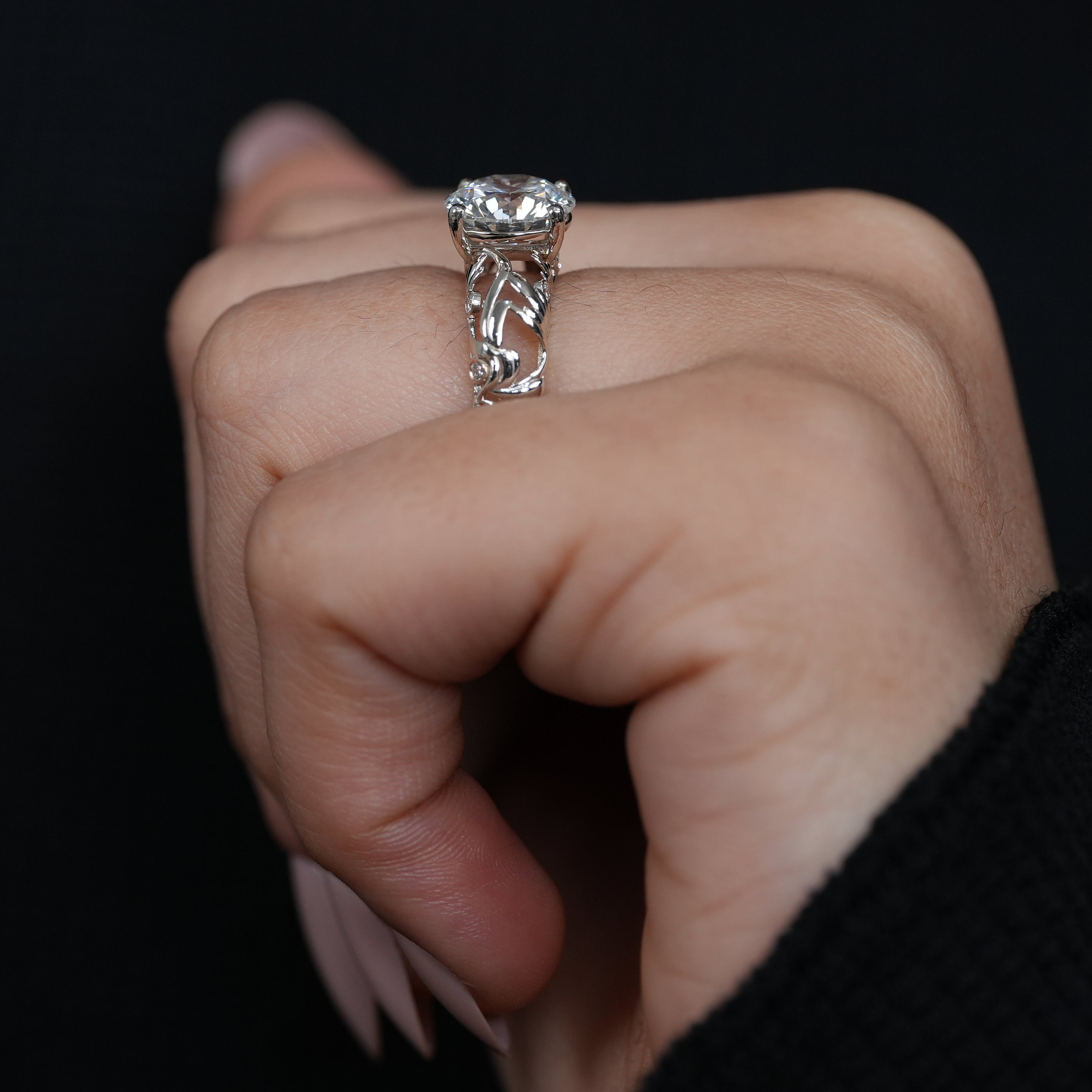 Fine jewelry engagement ring with round lab grown diamond and sculptural gold shank