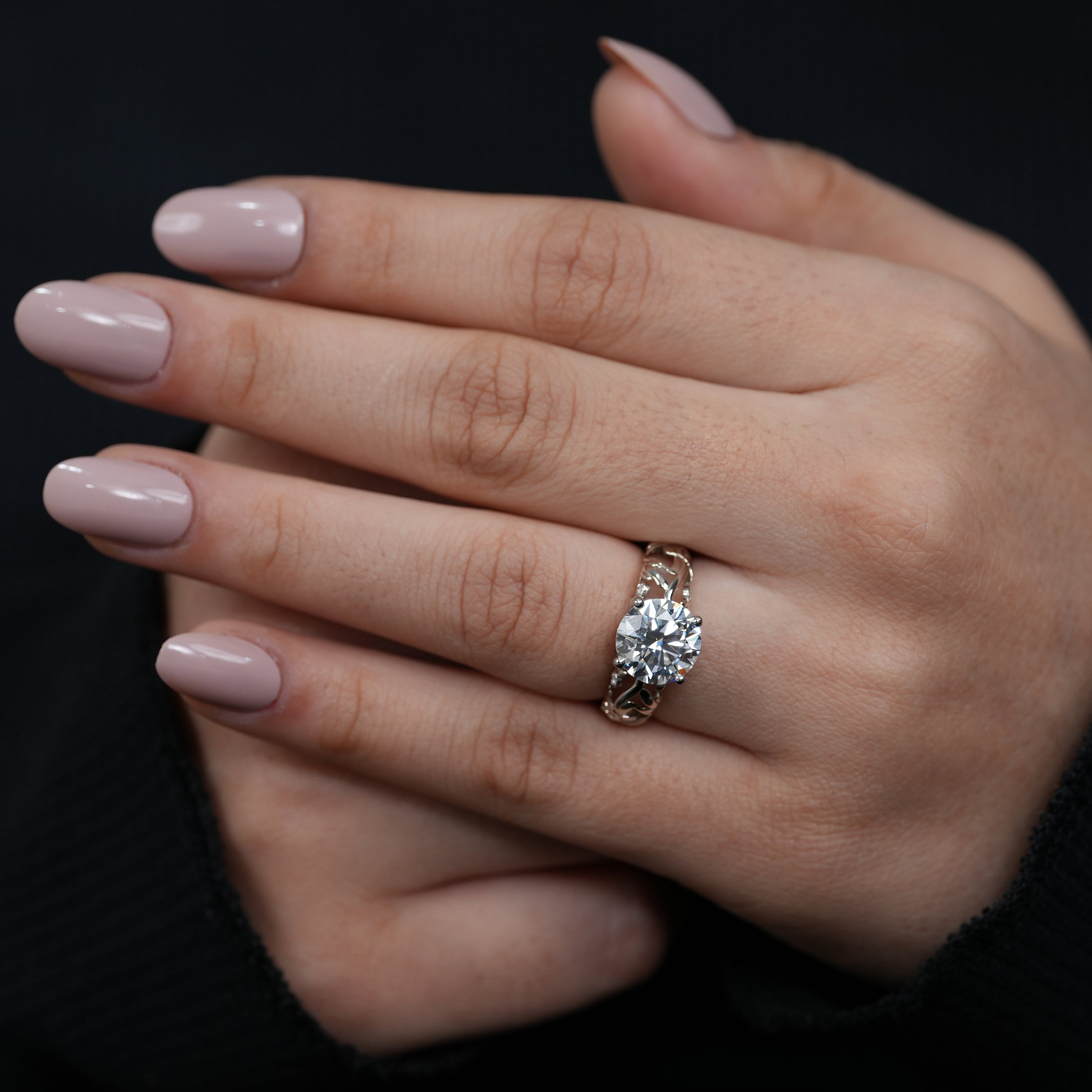 Timeless round lab grown diamond solitaire set in flowing two tone gold band