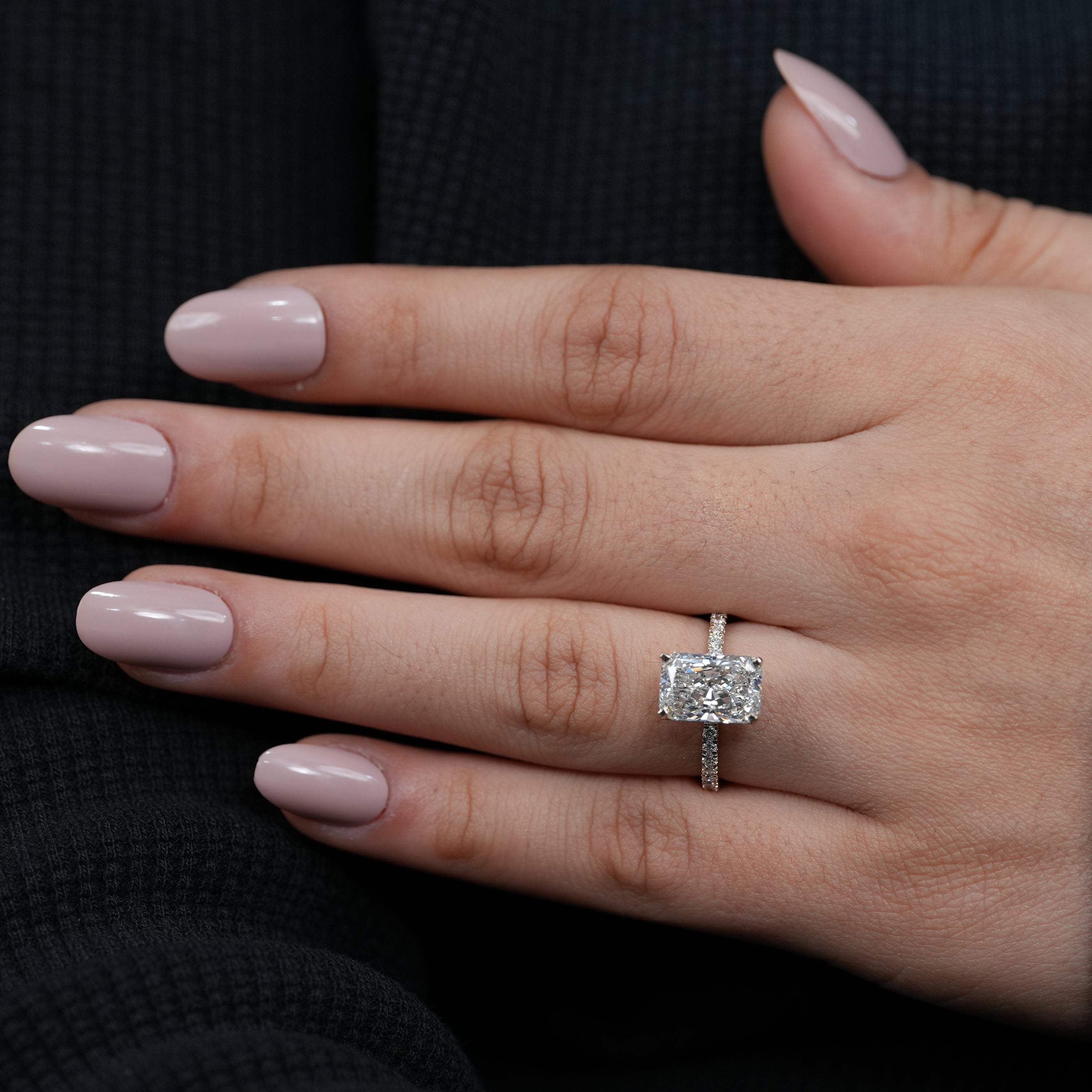 Luxury radiant lab grown diamond engagement ring four-prong setting delicate pavé band.