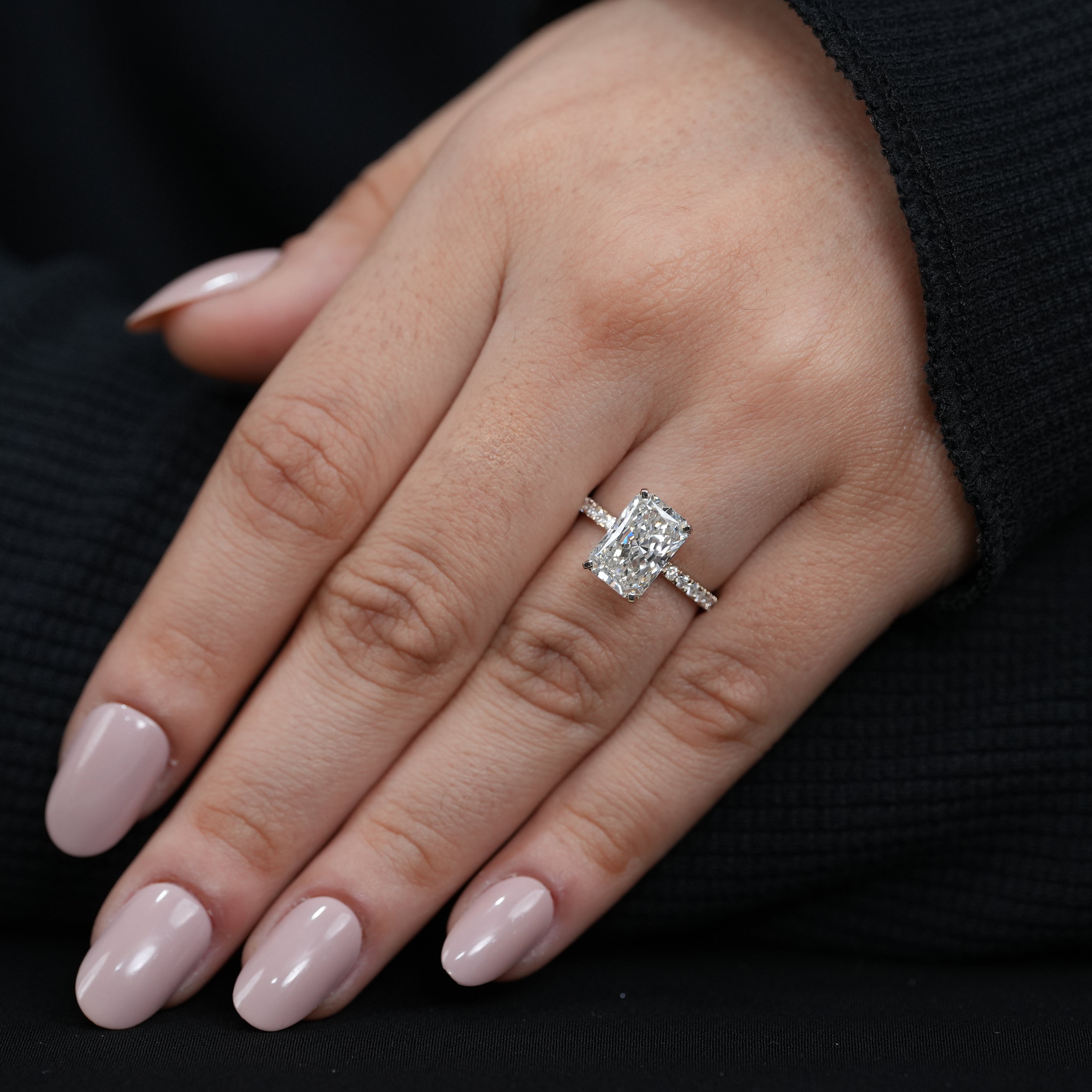 Minimalist radiant lab grown diamond engagement ring refined gold band micro pavé details.