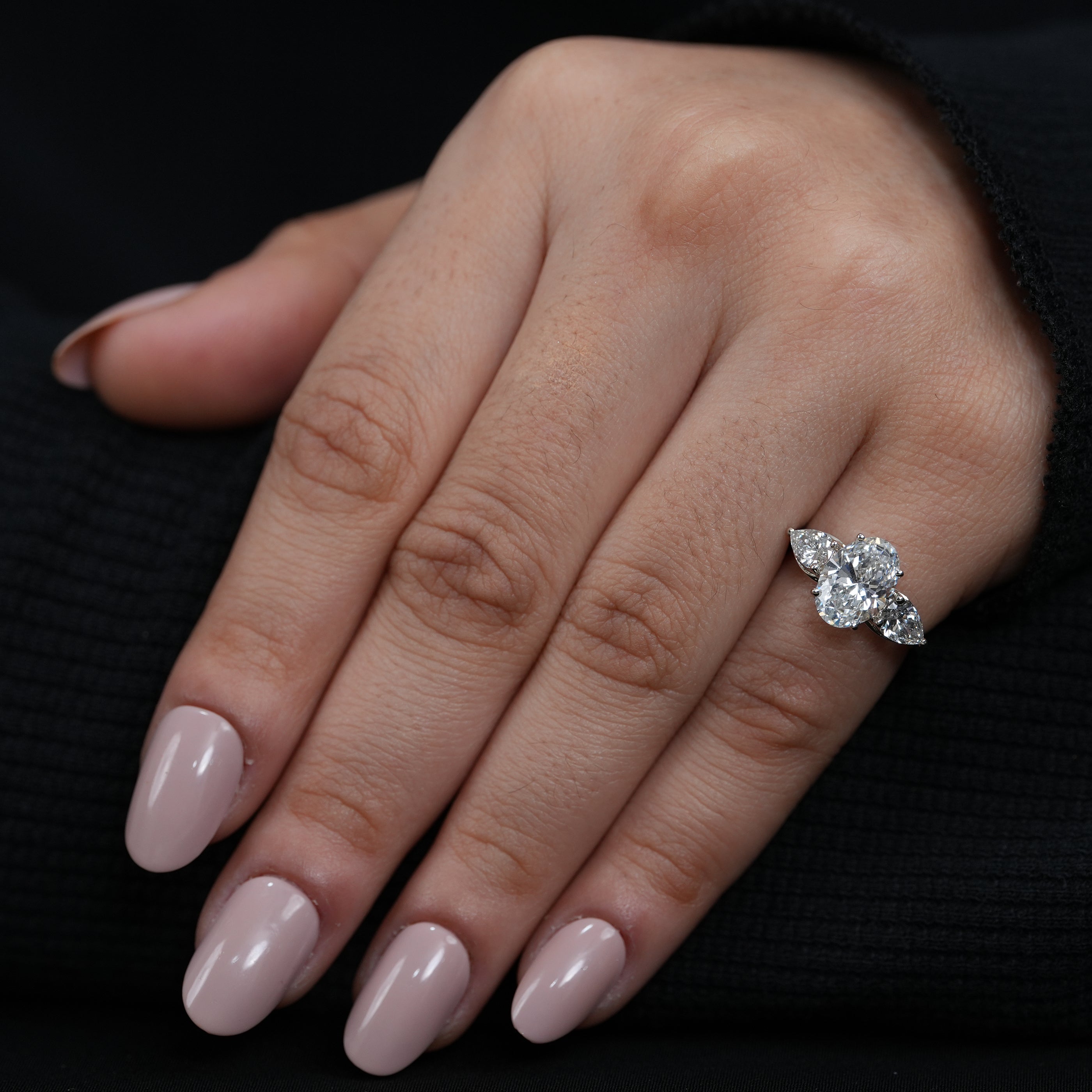 Elegant oval lab grown diamond engagement ring refined three stone design