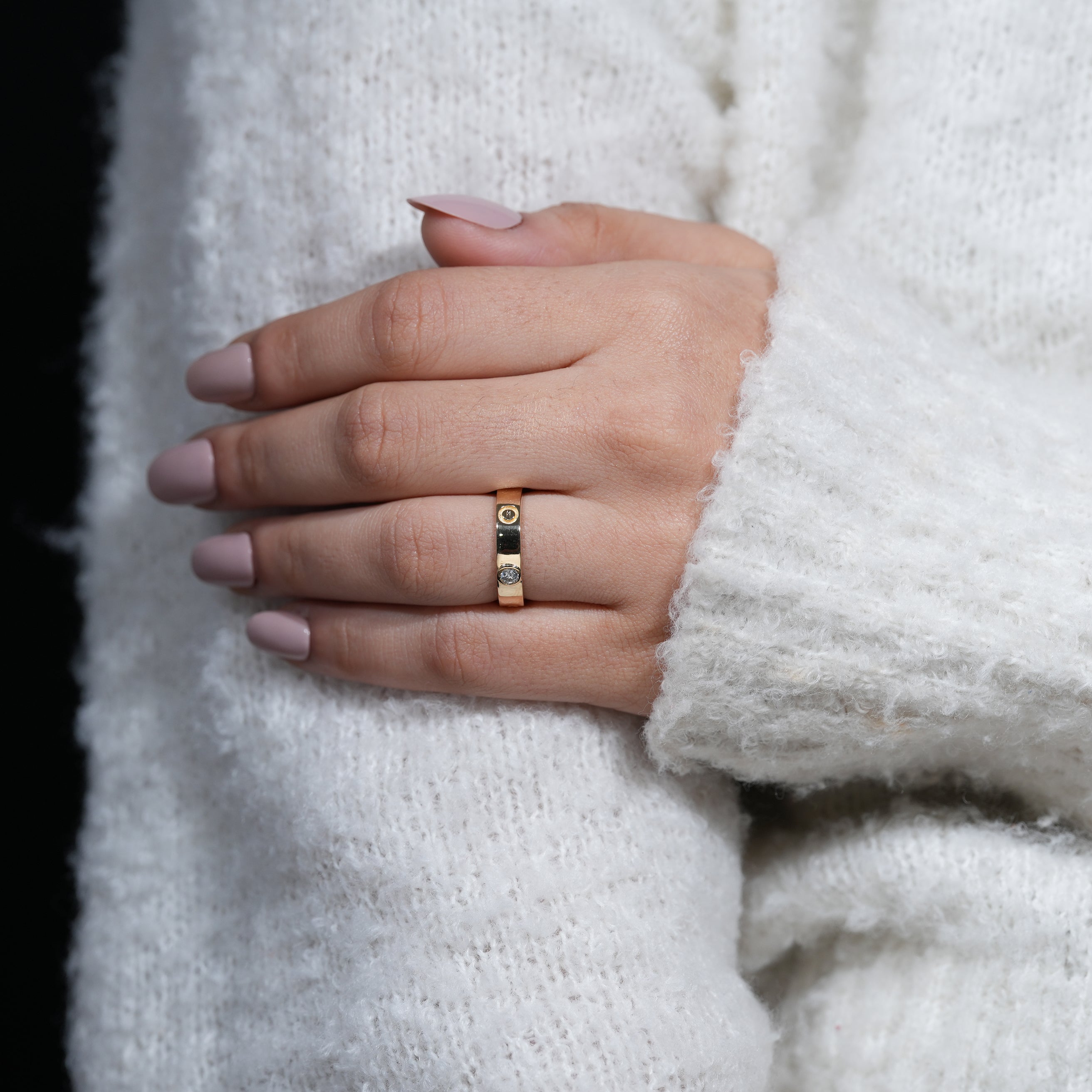 Fine jewelry gold band featuring evenly spaced lab grown diamonds