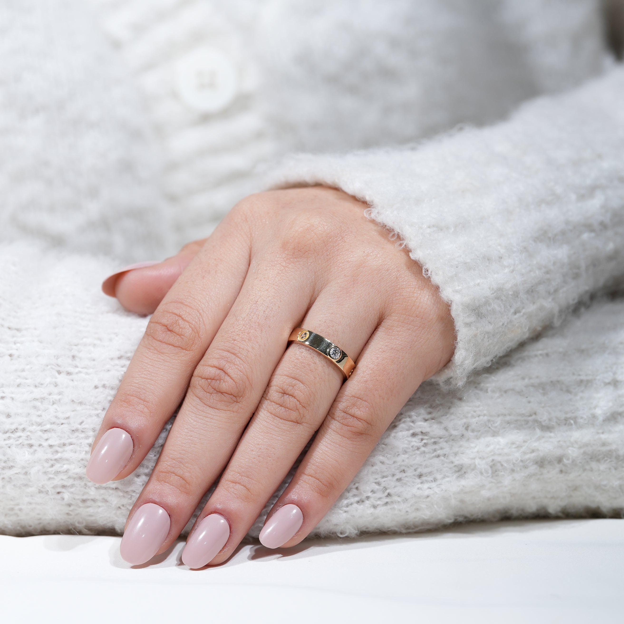 Designer gold band ring with embedded lab grown diamond accents