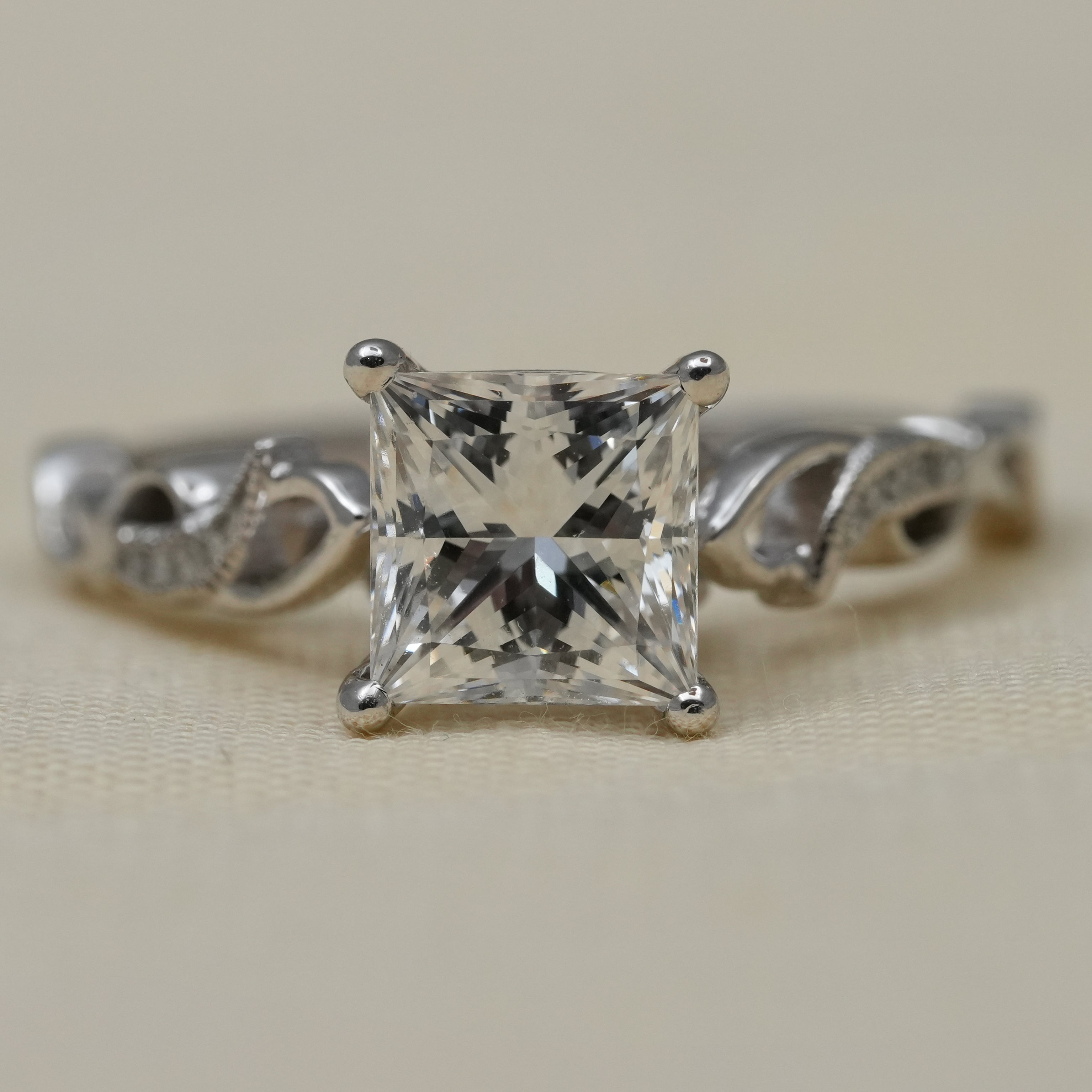 Princess cut lab grown diamond engagement ring with twisted vine band.