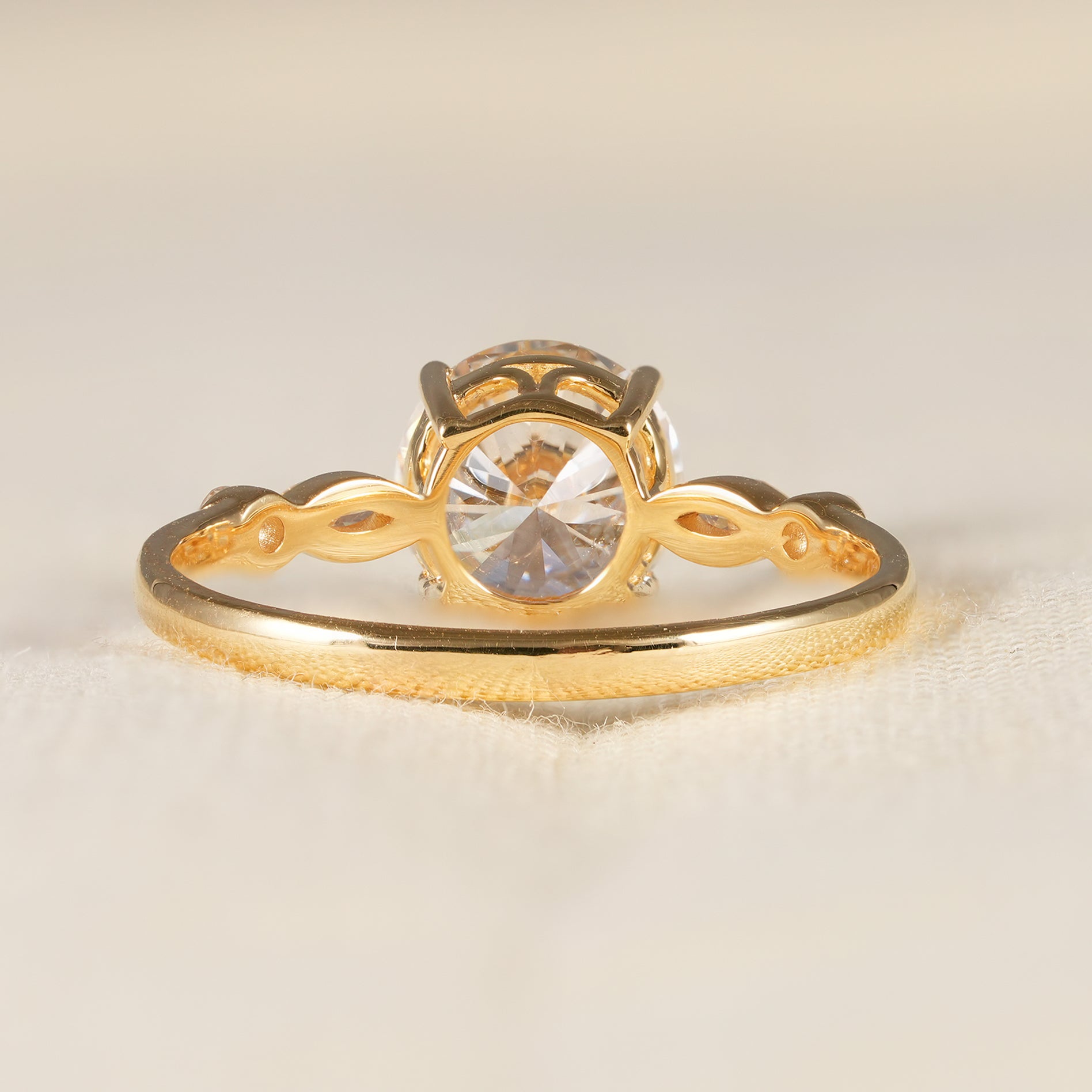 Classic round engagement ring with delicate diamond accented gold band