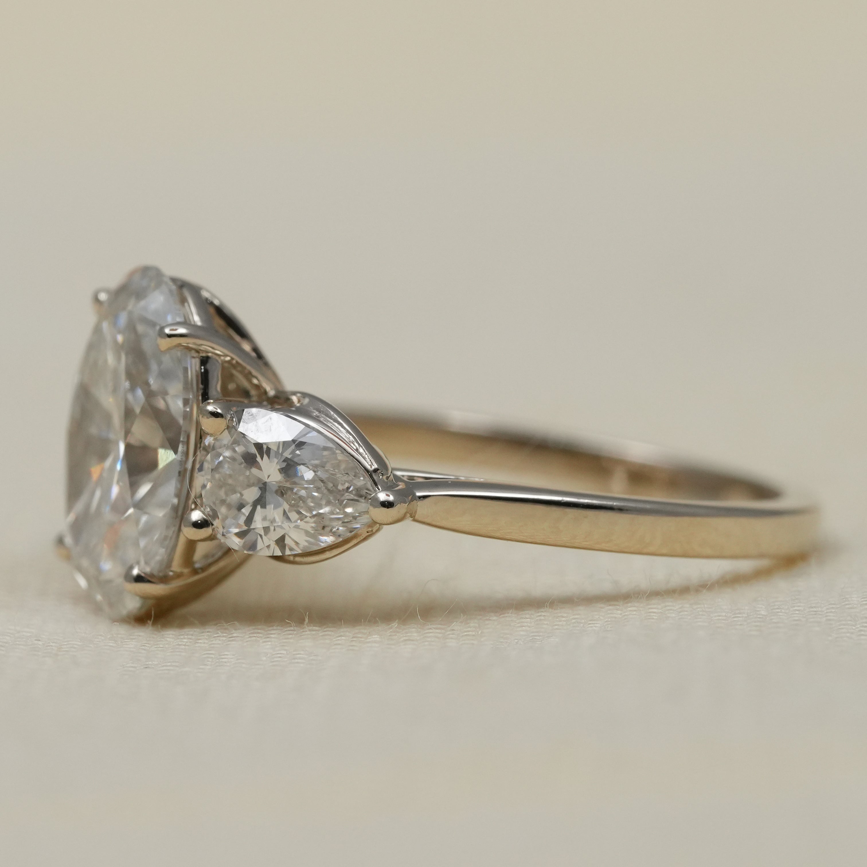 Luxury oval lab-grown diamond proposal ring elegant pear side stones
