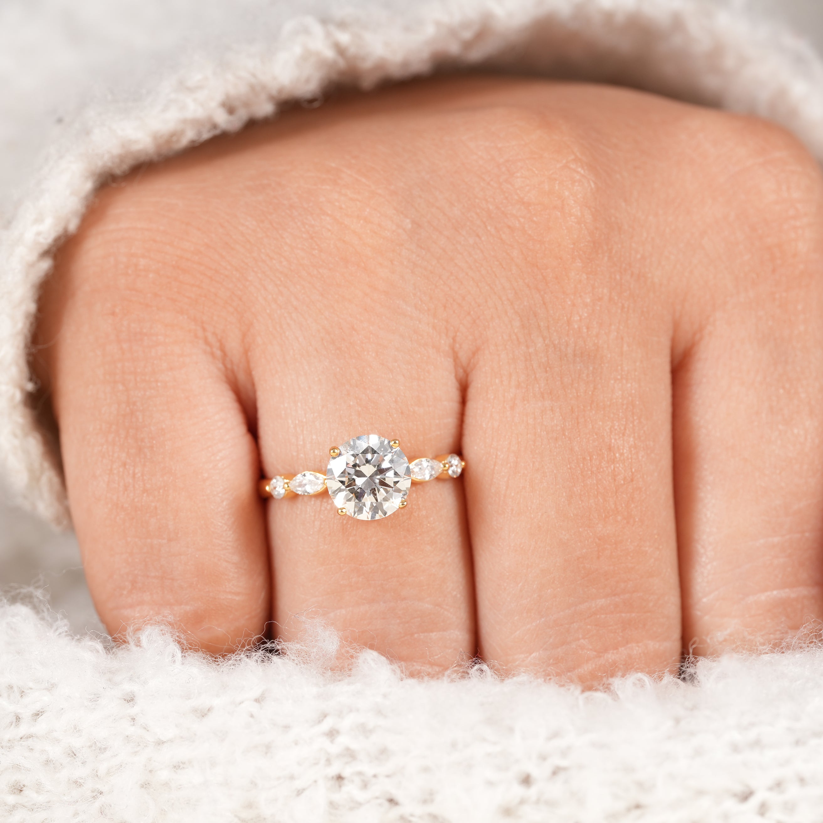 Luxury round cut engagement ring with elegant diamond accent design