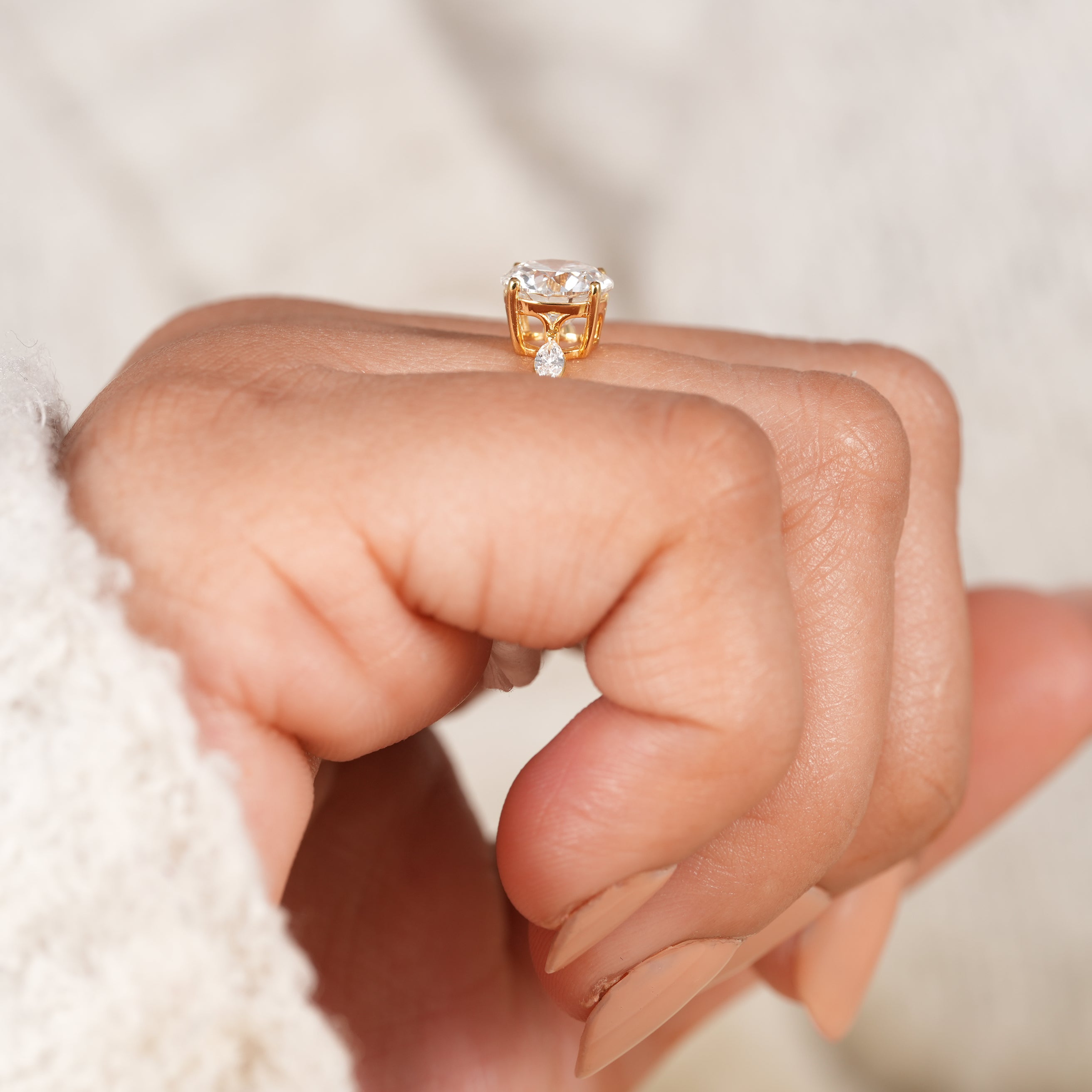 Romantic yellow gold engagement ring with sparkling diamond accents