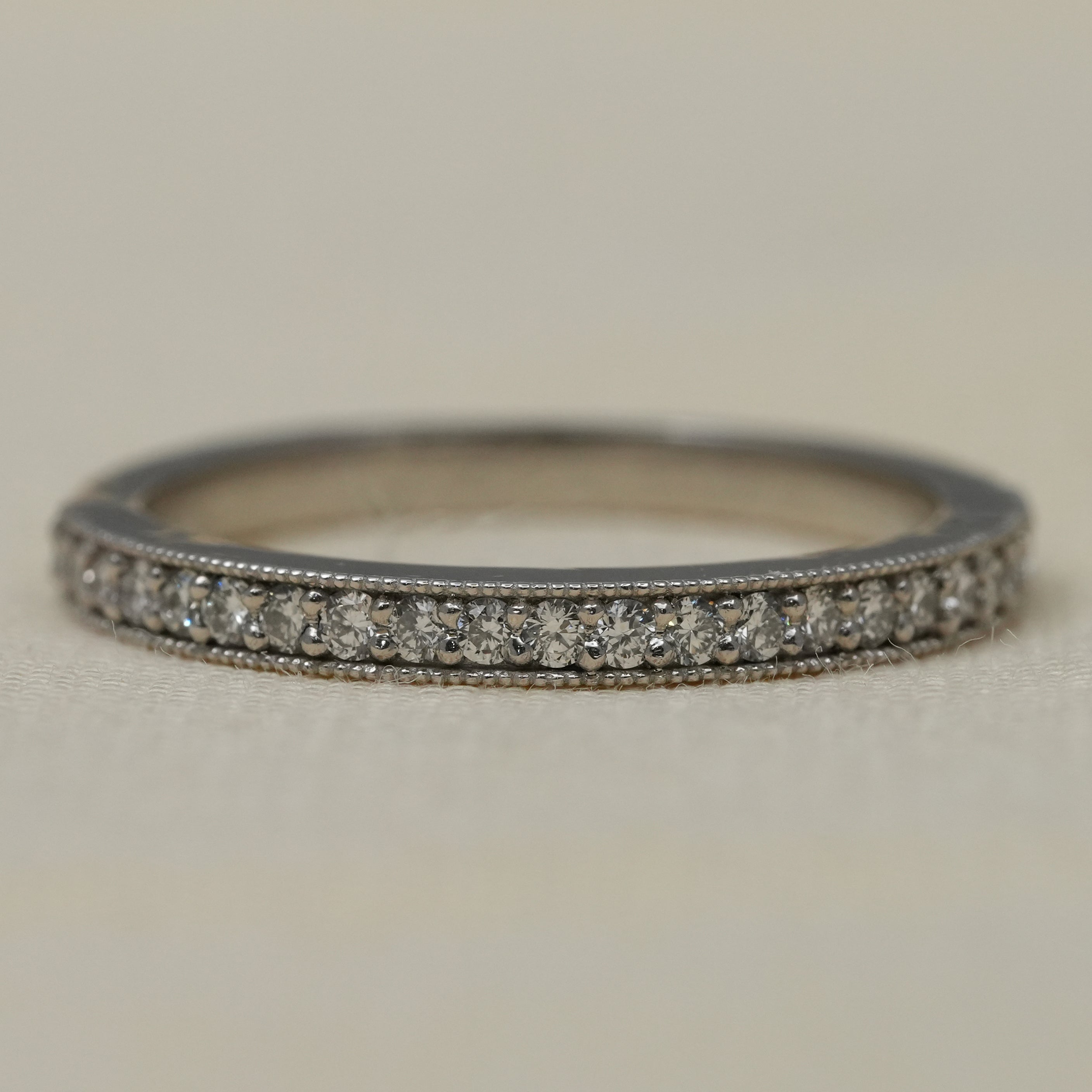 Slim white gold pavé band with lab grown diamonds and milgrain edges