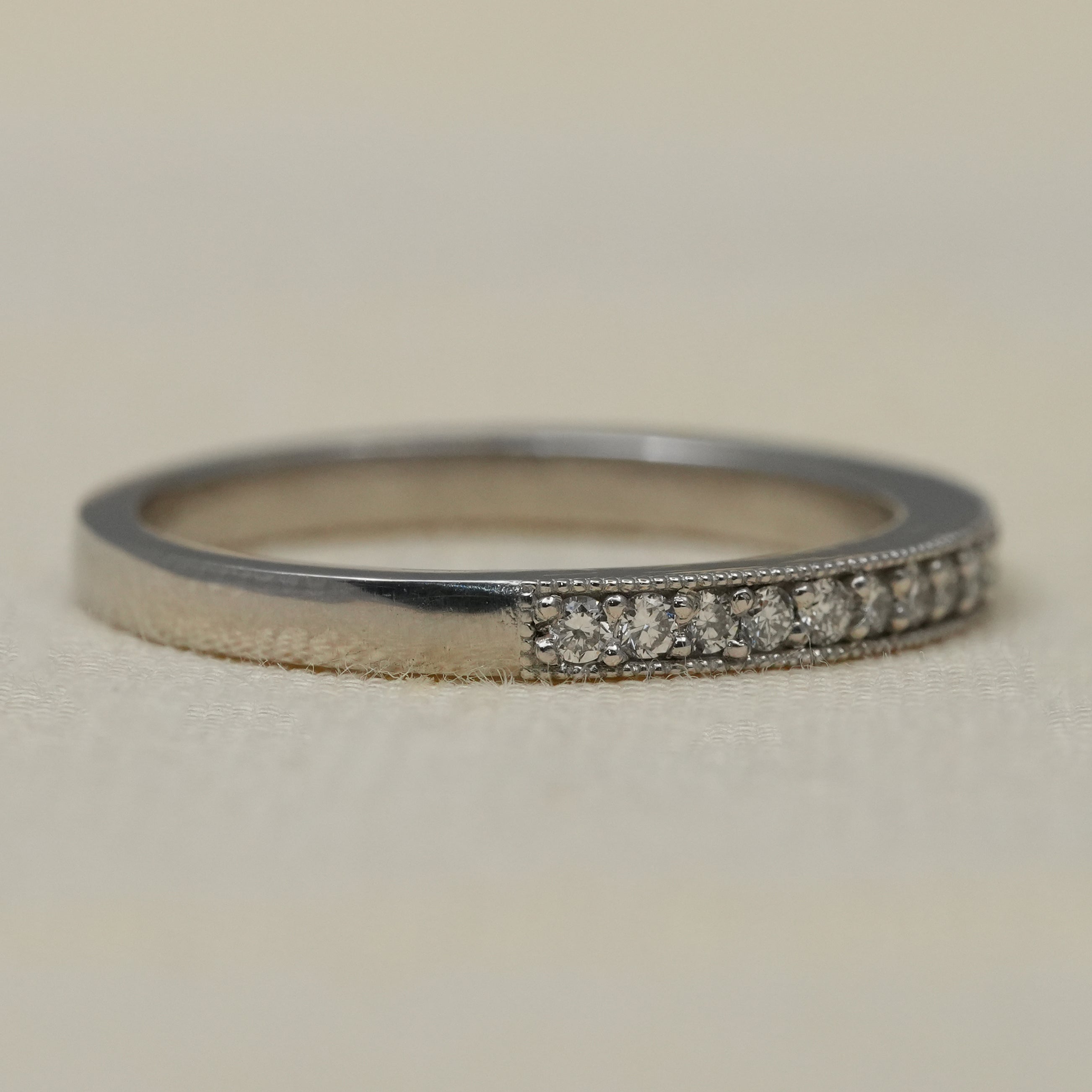 Minimalist white gold eternity band with round lab grown diamonds pavé