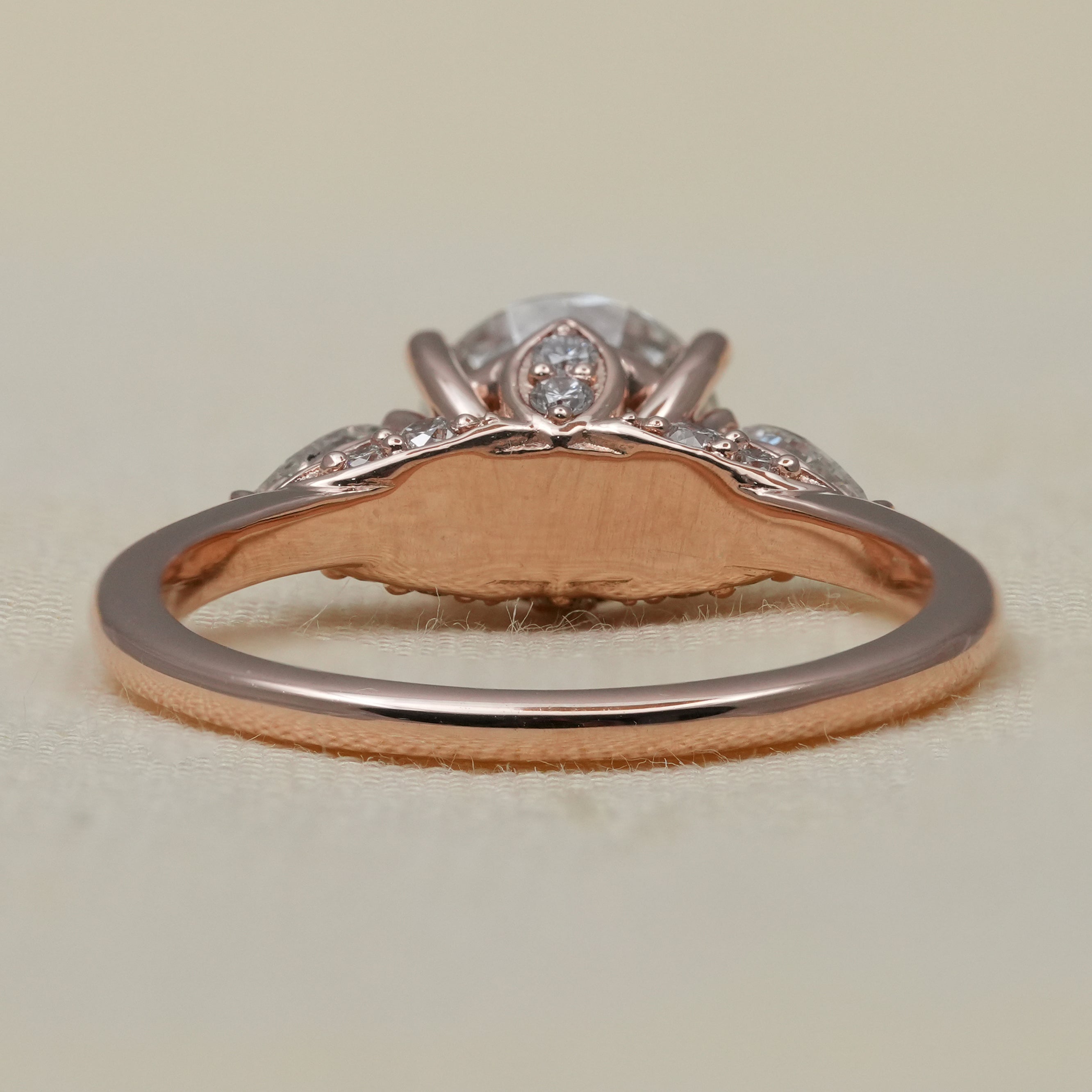 Three Stone Round Lab Diamond Engagement Ring with Pear Side Stones