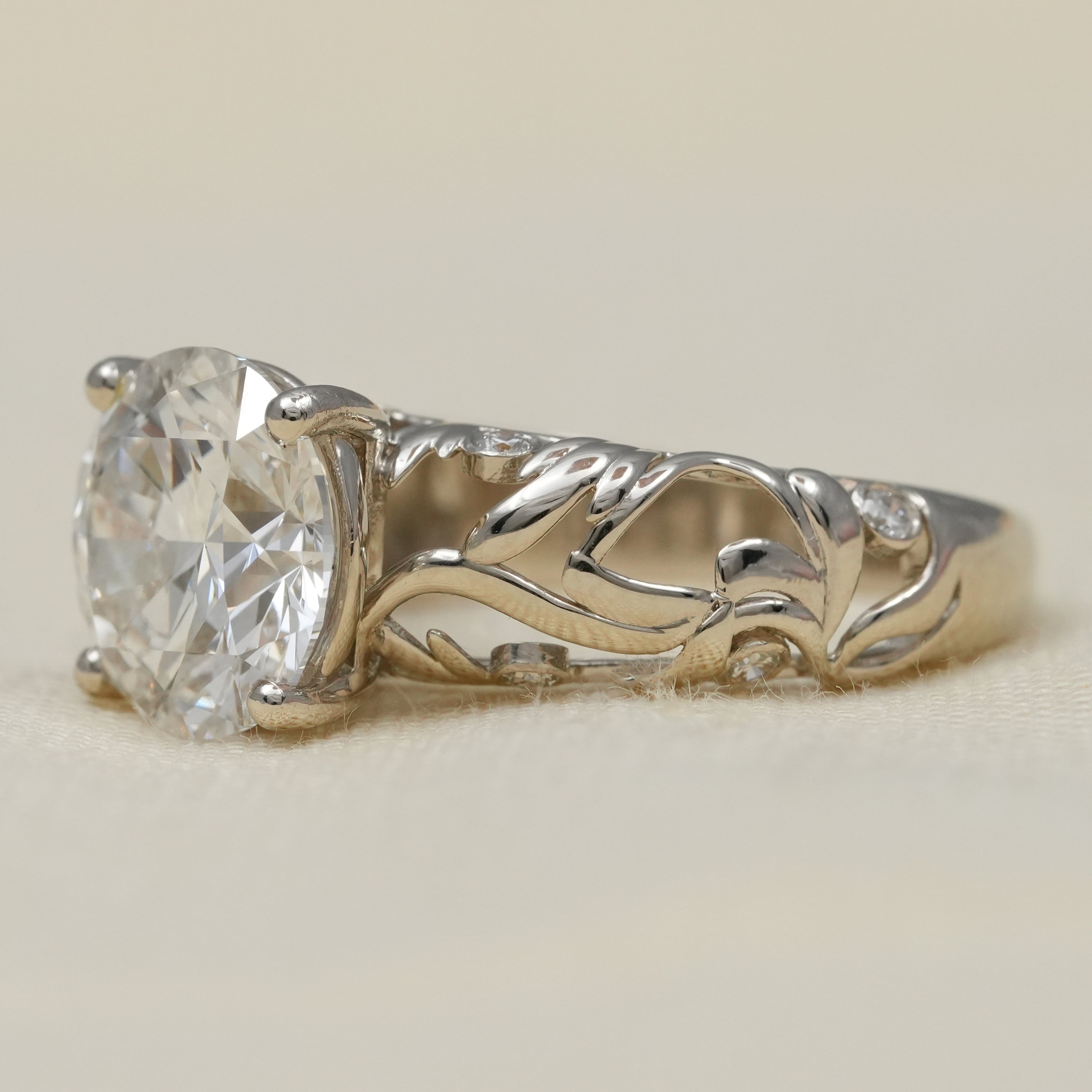 Vintage inspired round lab grown diamond ring with sculpted leaf motif band