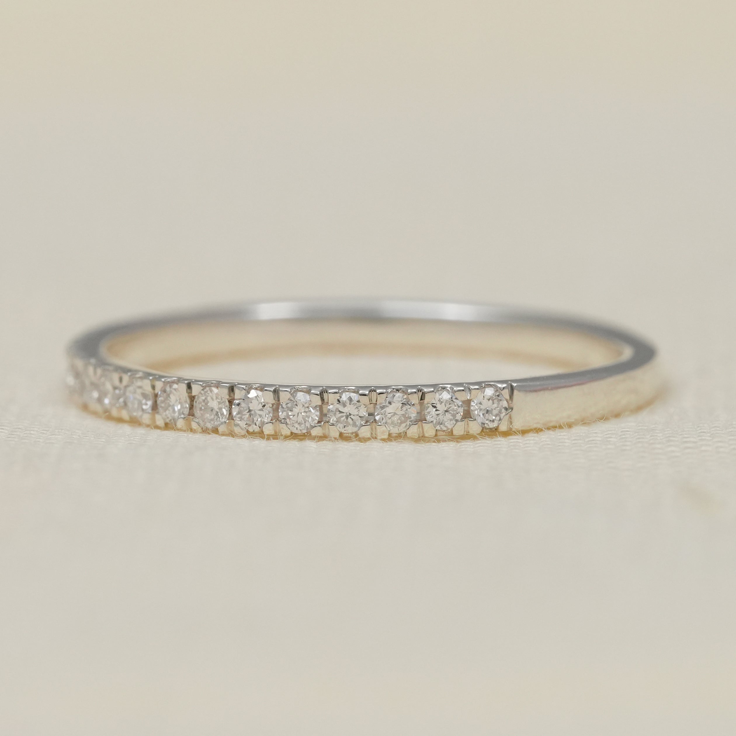 Delicate lab grown diamond eternity style band slim polished two tone gold.