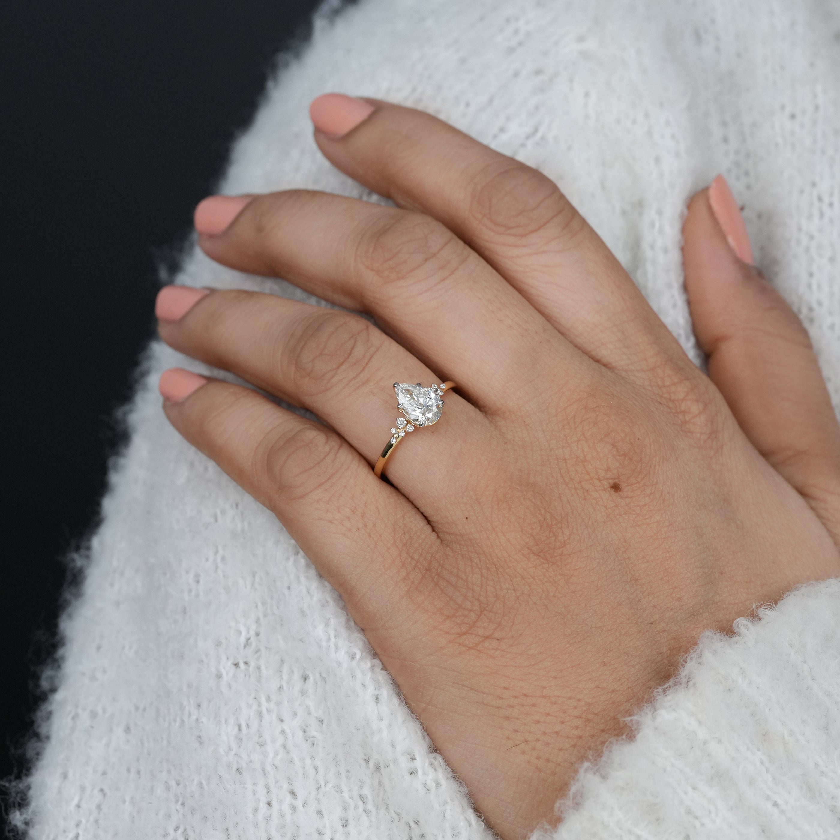 Romantic pear lab grown diamond ring with shimmering accent diamonds