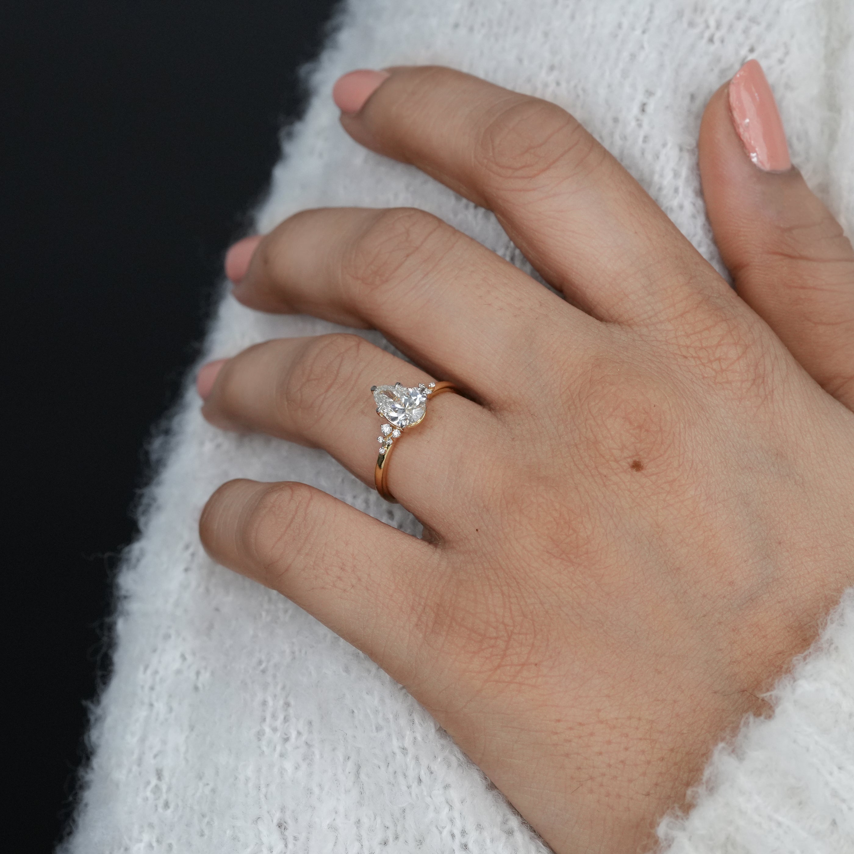 Designer pear lab grown diamond ring with graceful floral accent stones