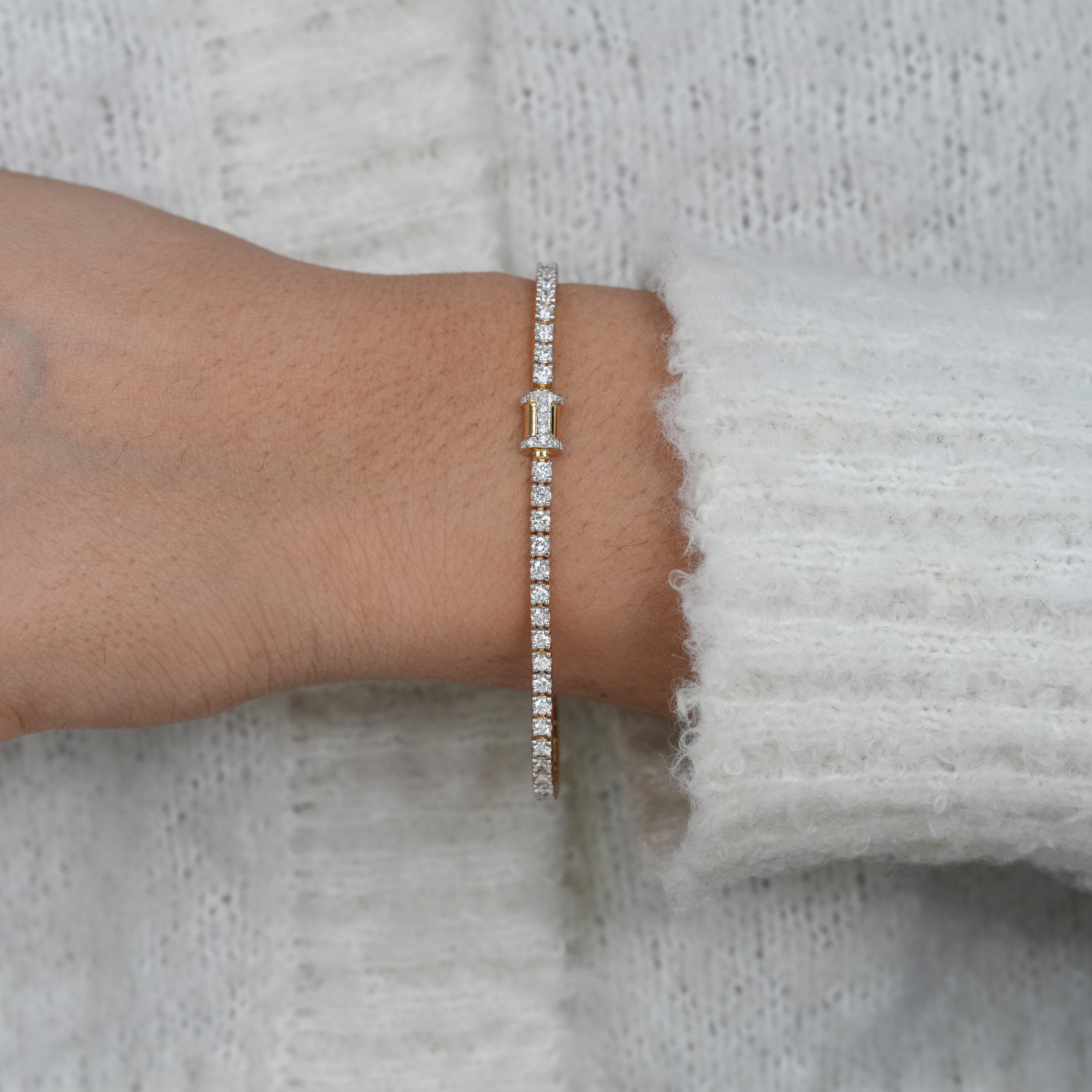 Modern lab grown diamond bracelet with polished yellow gold finish