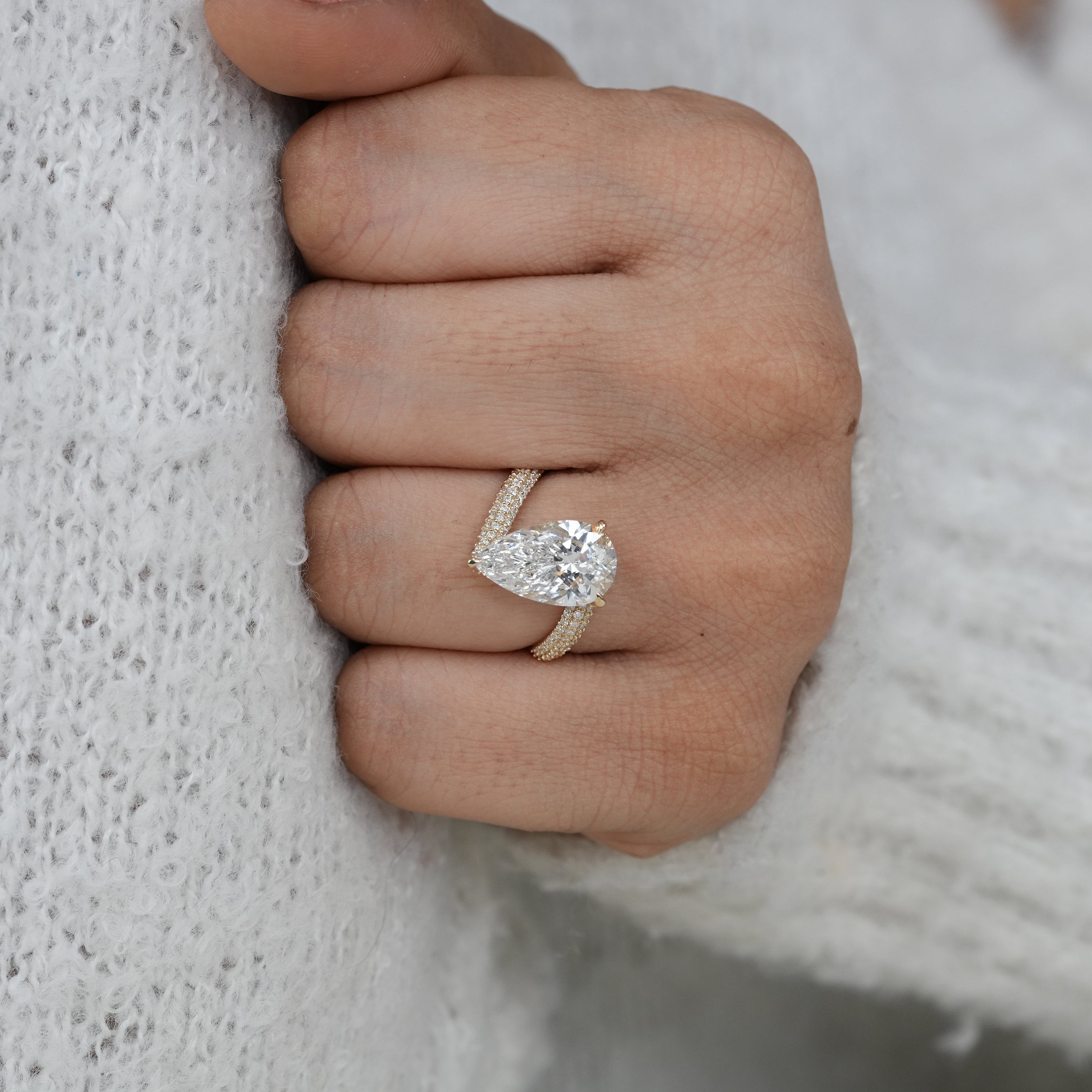 Designer pear lab grown diamond ring with elegant curved pavé styling