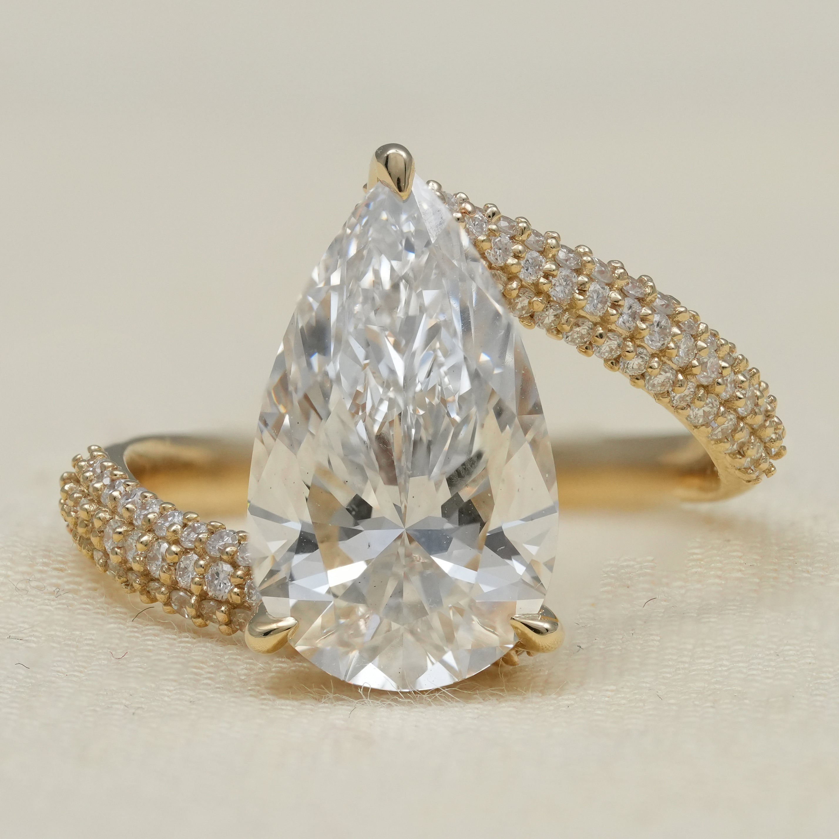 Luxury pear lab grown diamond engagement ring with pavé gold band