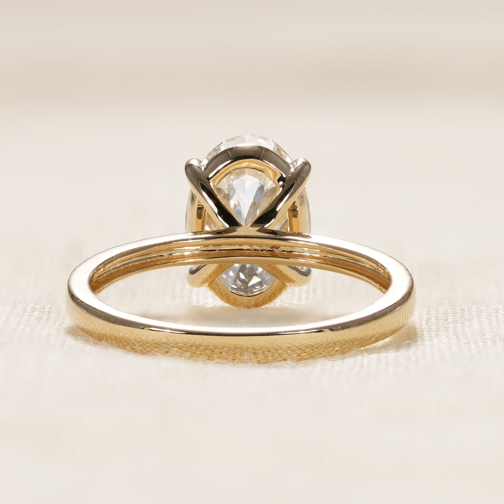 Minimalist oval diamond ring for women with modern yellow gold band