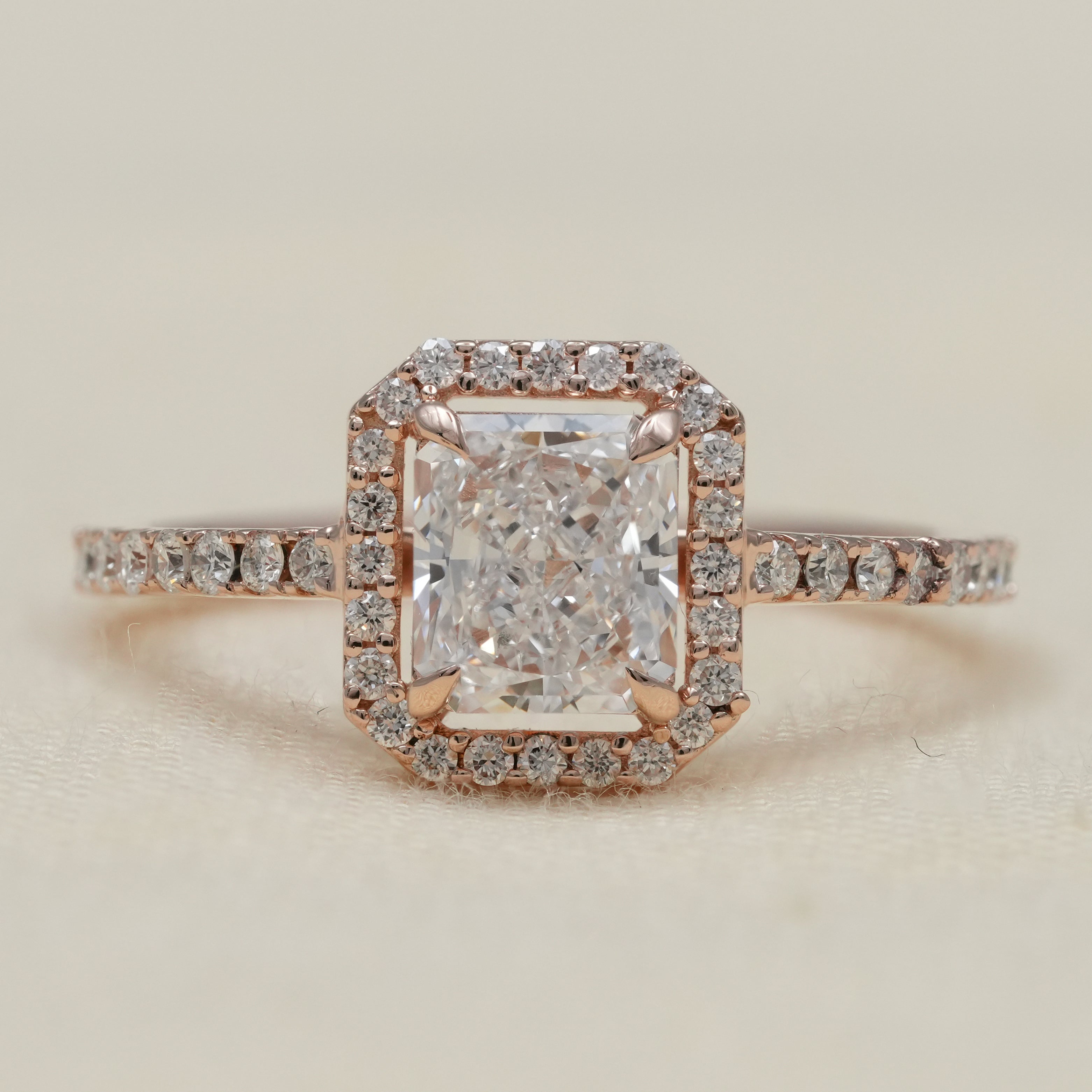 Radiant lab grown diamond engagement ring with rose gold halo
