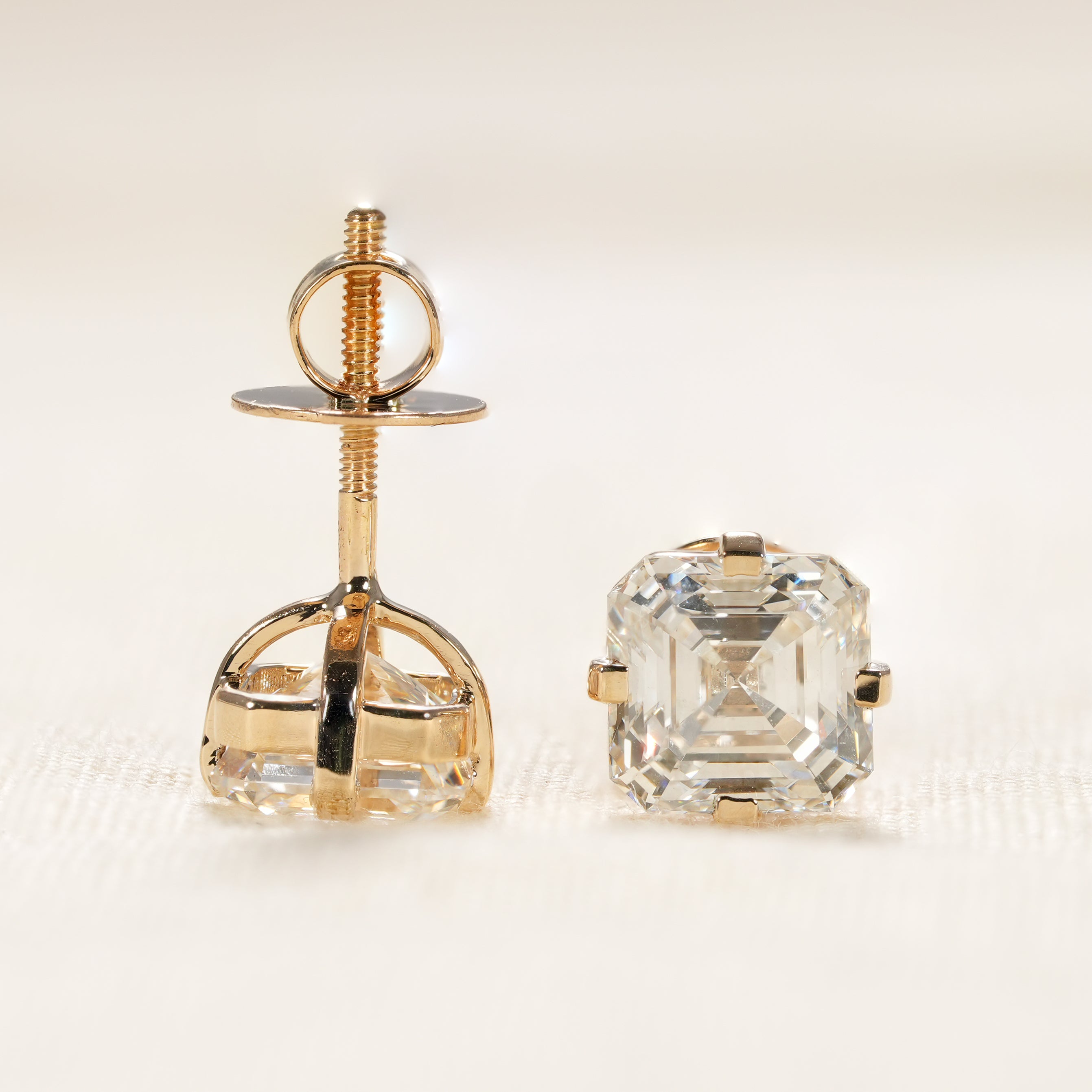 Minimalist lab diamond stud earrings with classic four prong gold setting