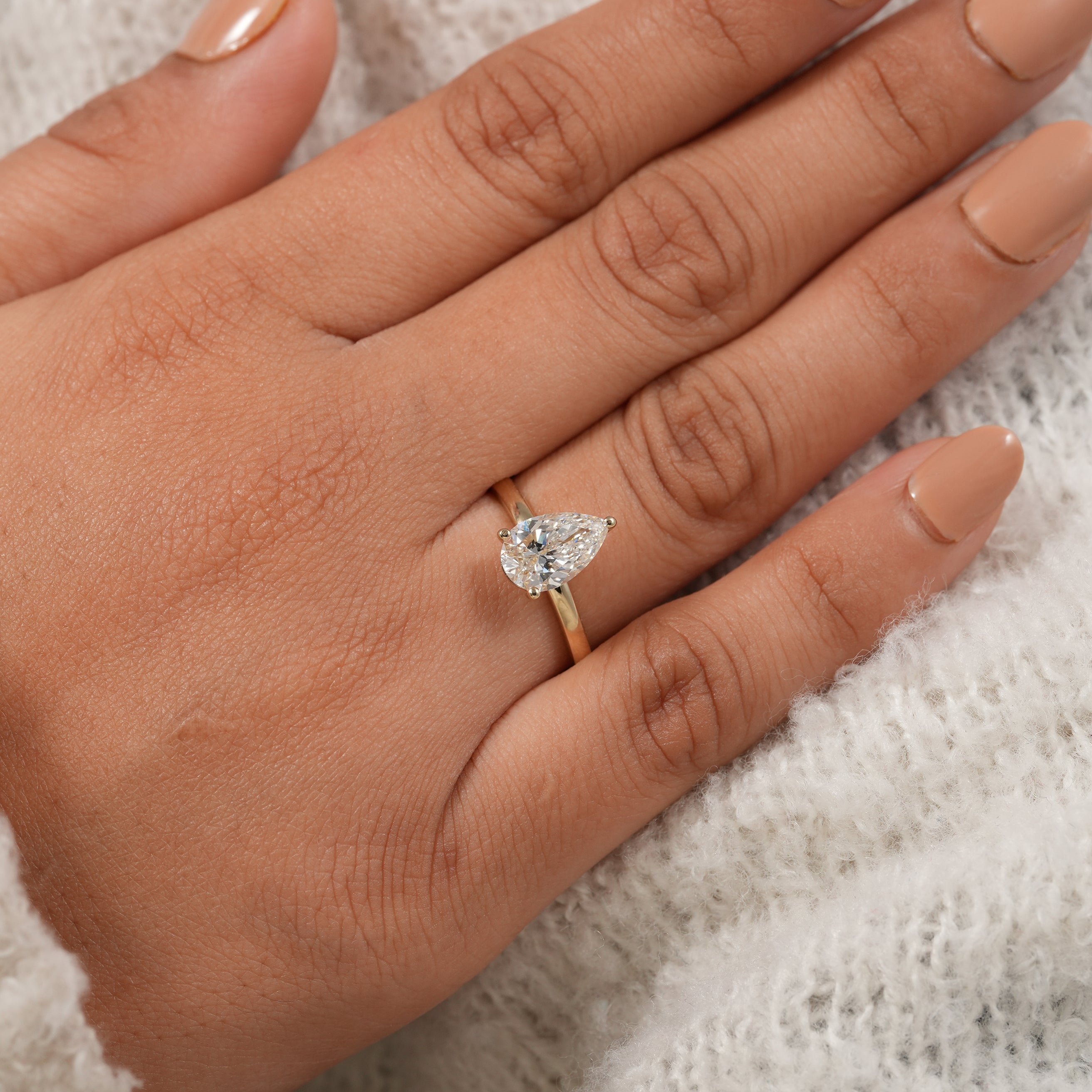 Timeless pear cut engagement ring for women with polished gold band