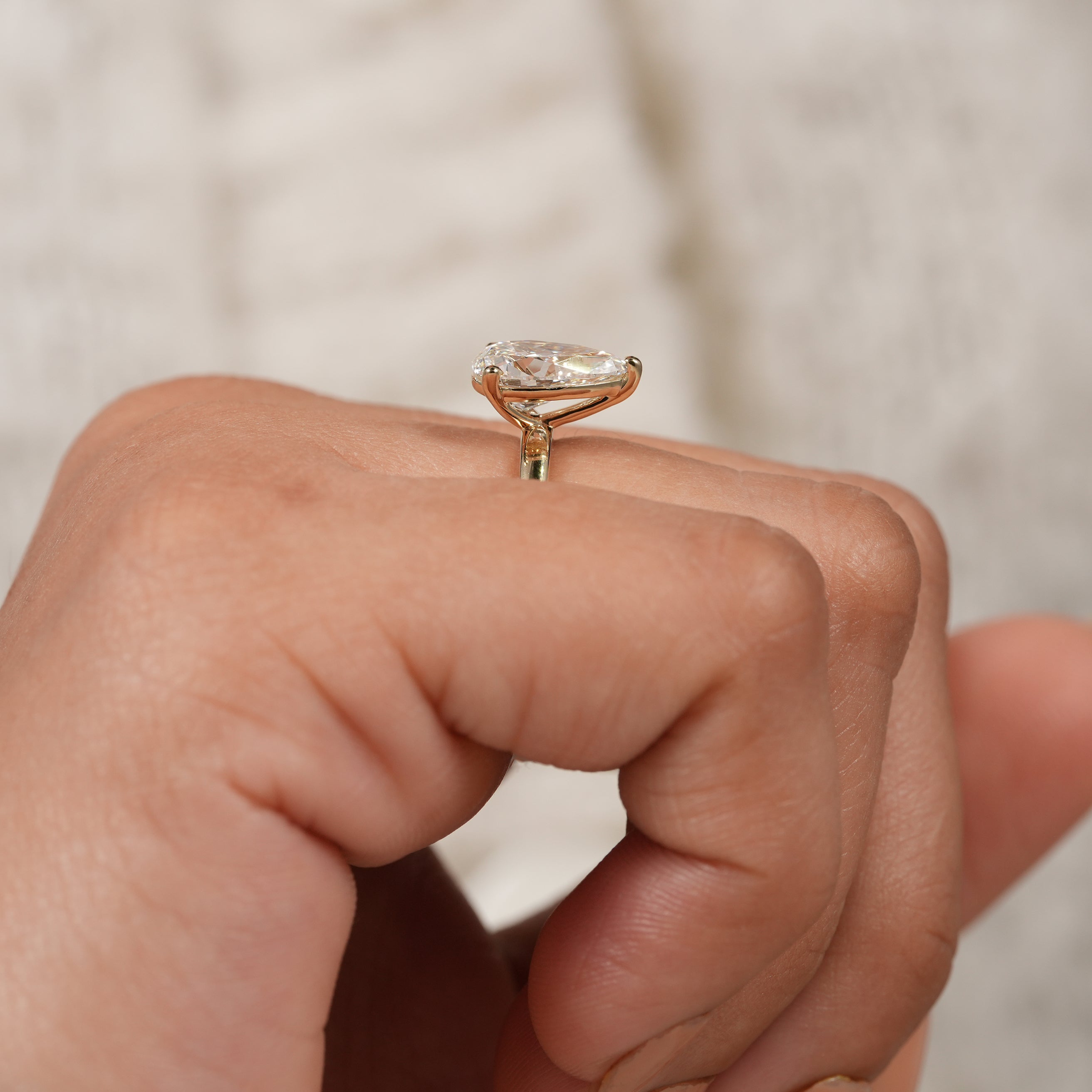 Dainty pear shaped lab diamond ring with classic bridal sophistication