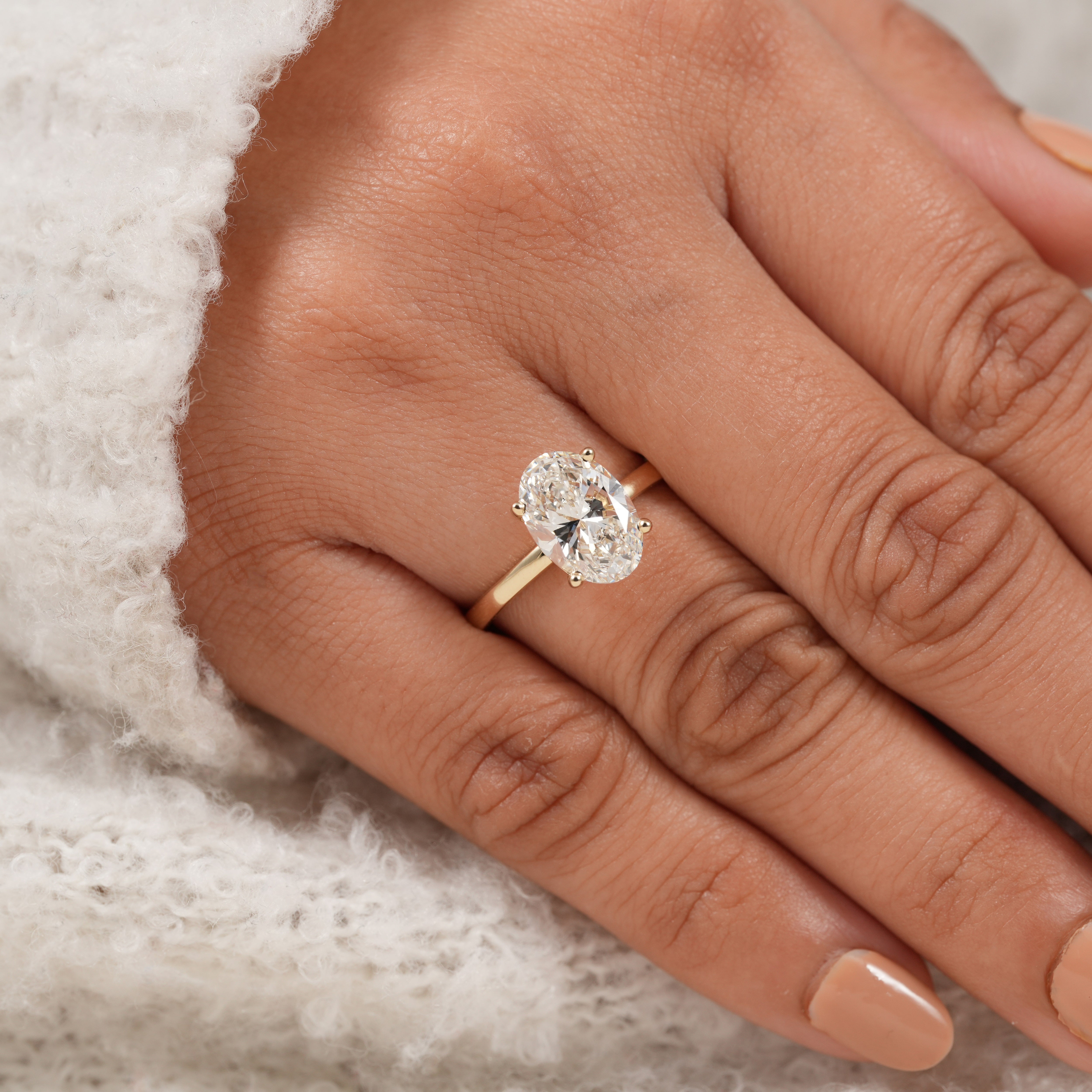 Dainty oval cut lab diamond ring with timeless classic engagement style