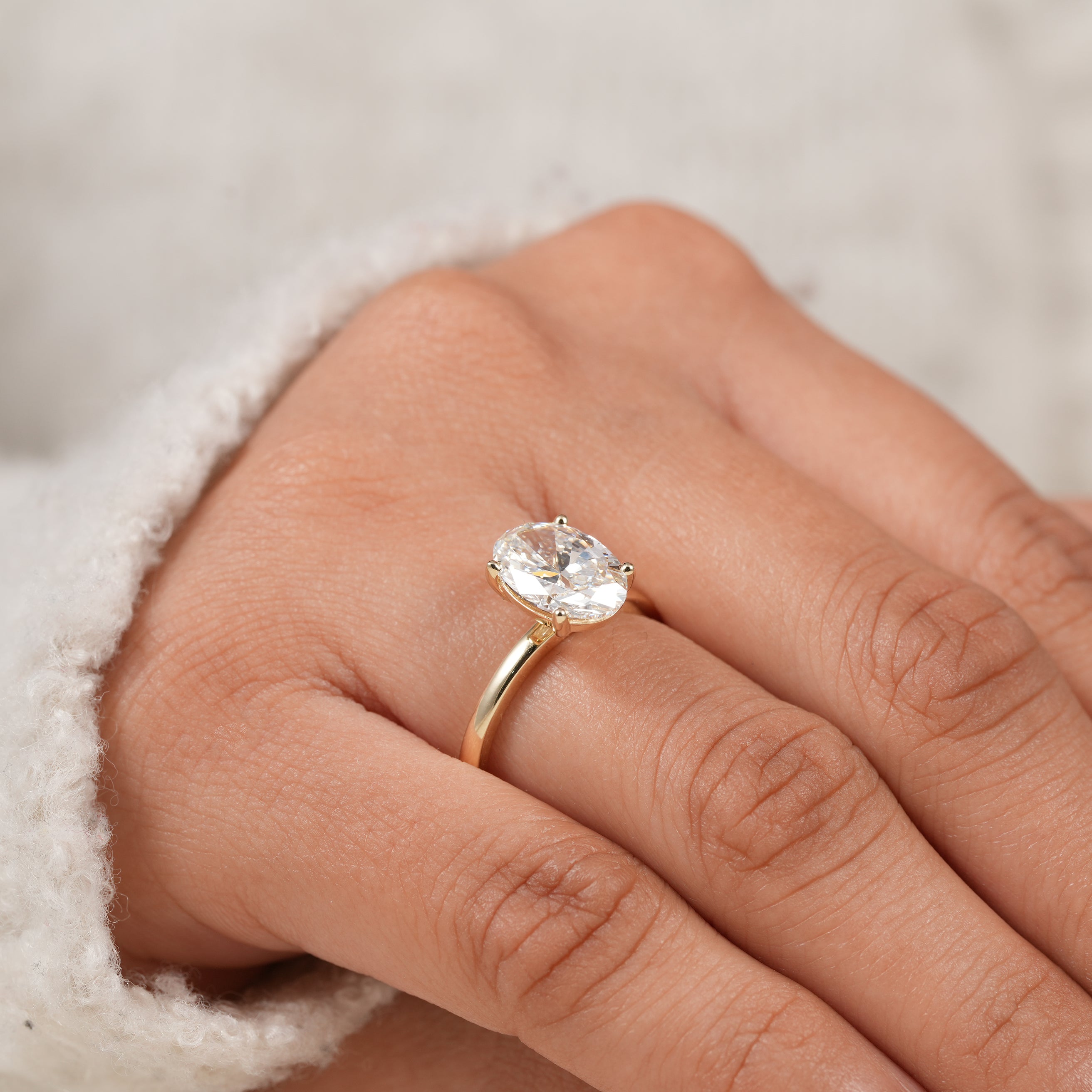 Fine jewelry oval cut lab diamond ring with elegant minimalist silhouette