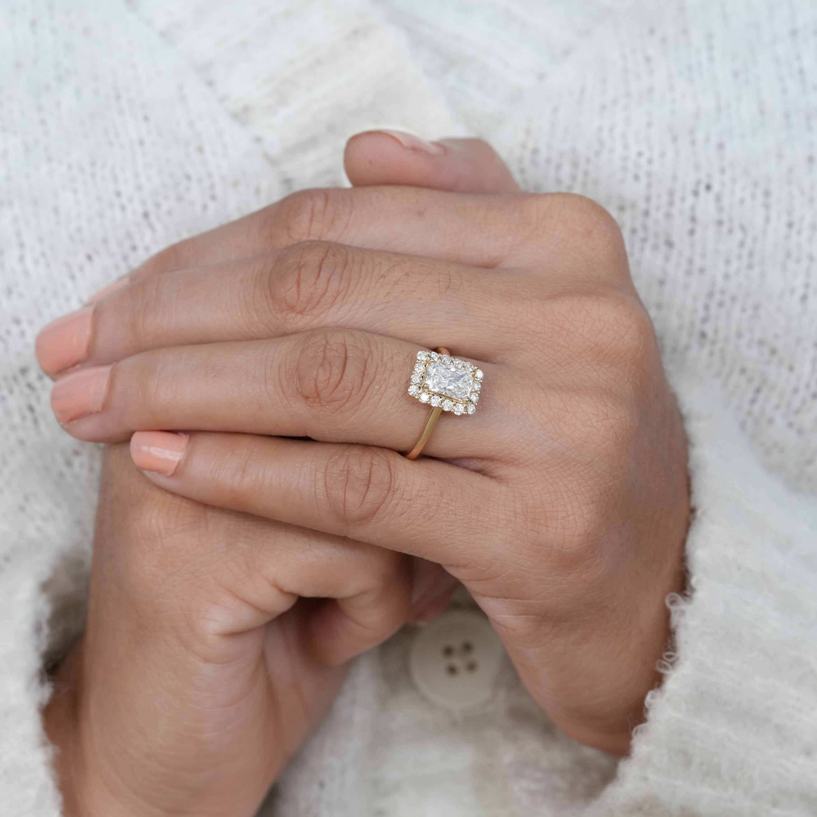 Statement rectangular radiant lab grown diamond ring with bold halo design