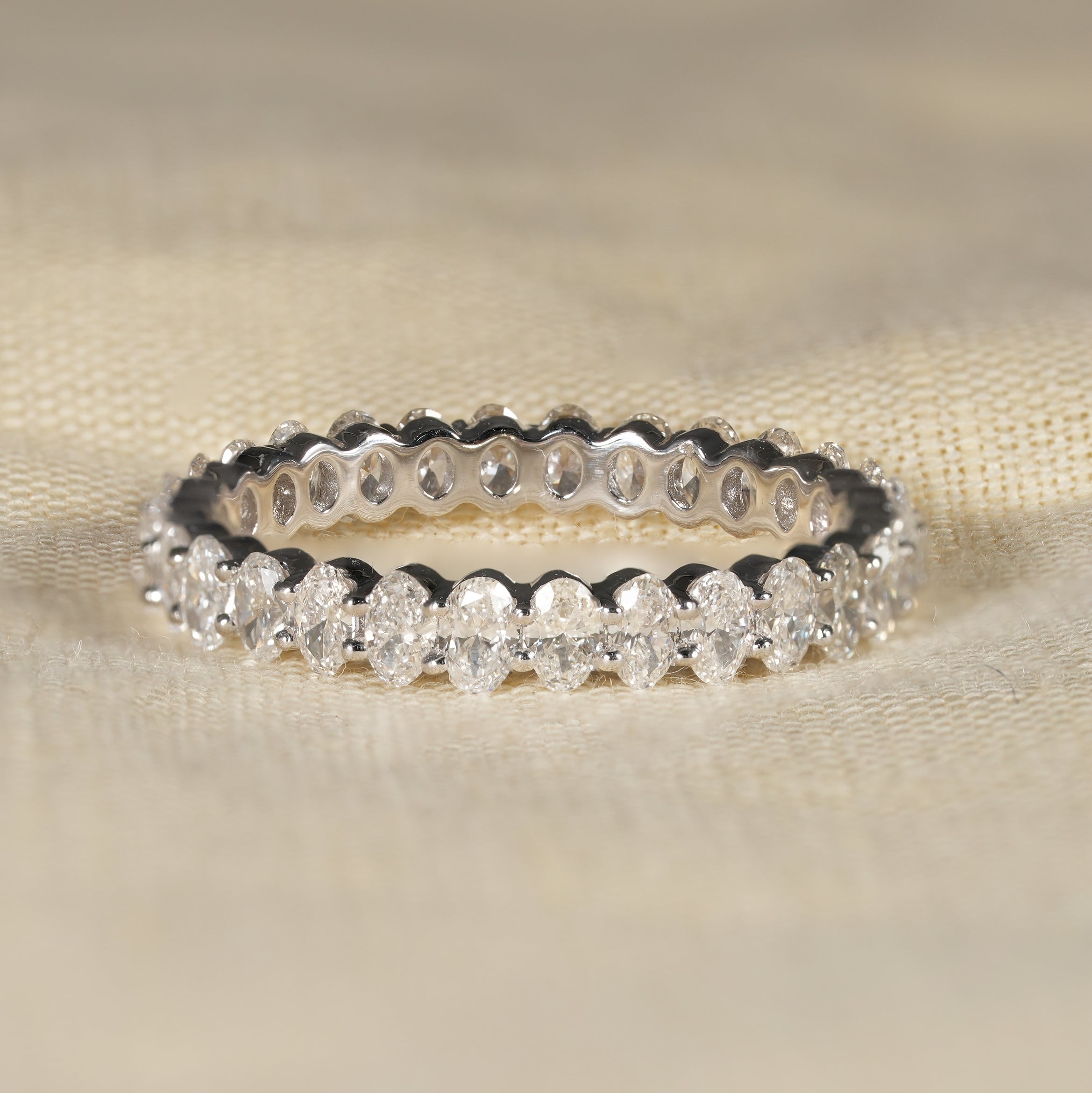 Oval cut lab grown diamond eternity wedding band in white gold