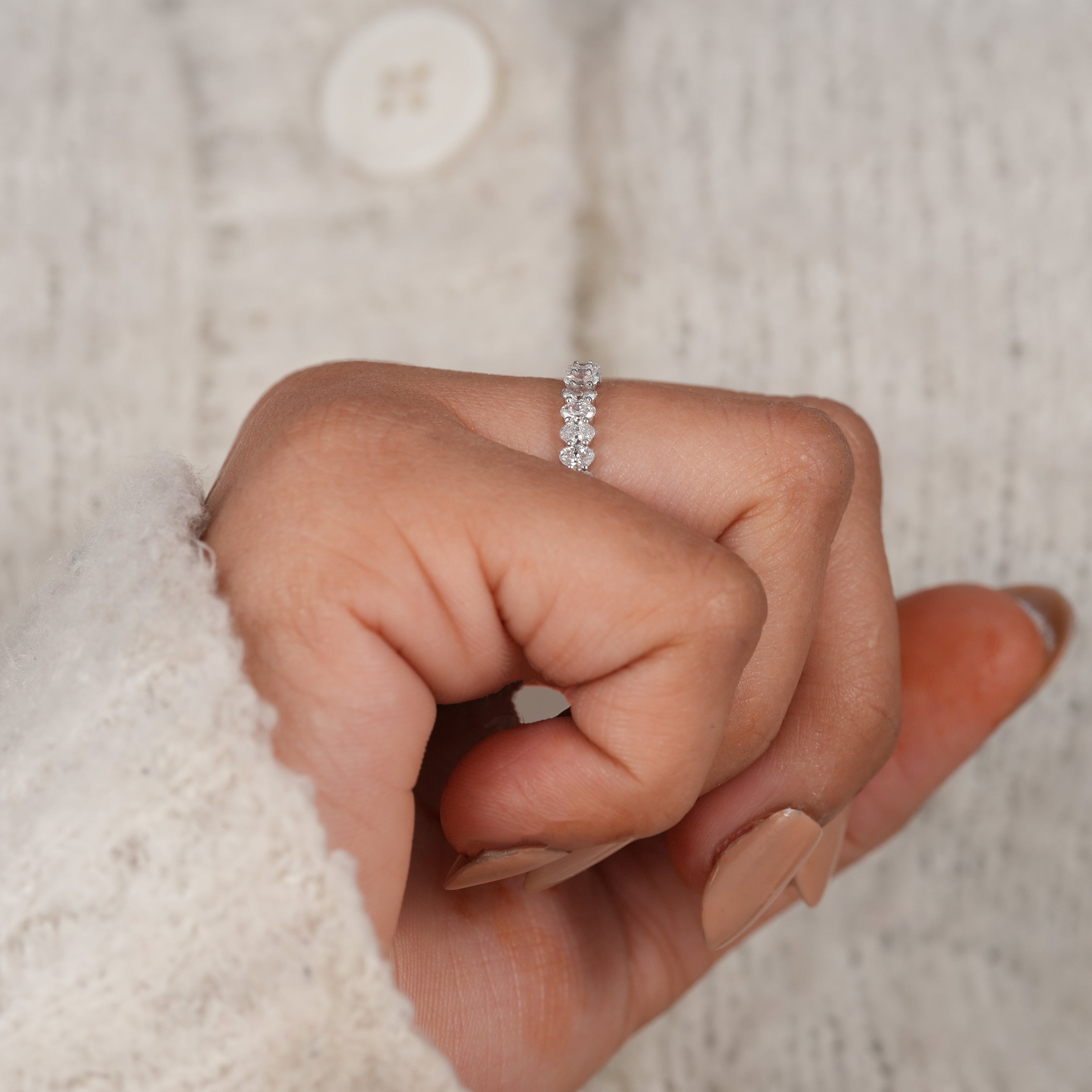 Elegant oval diamond eternity band with sparkling white gold finish
