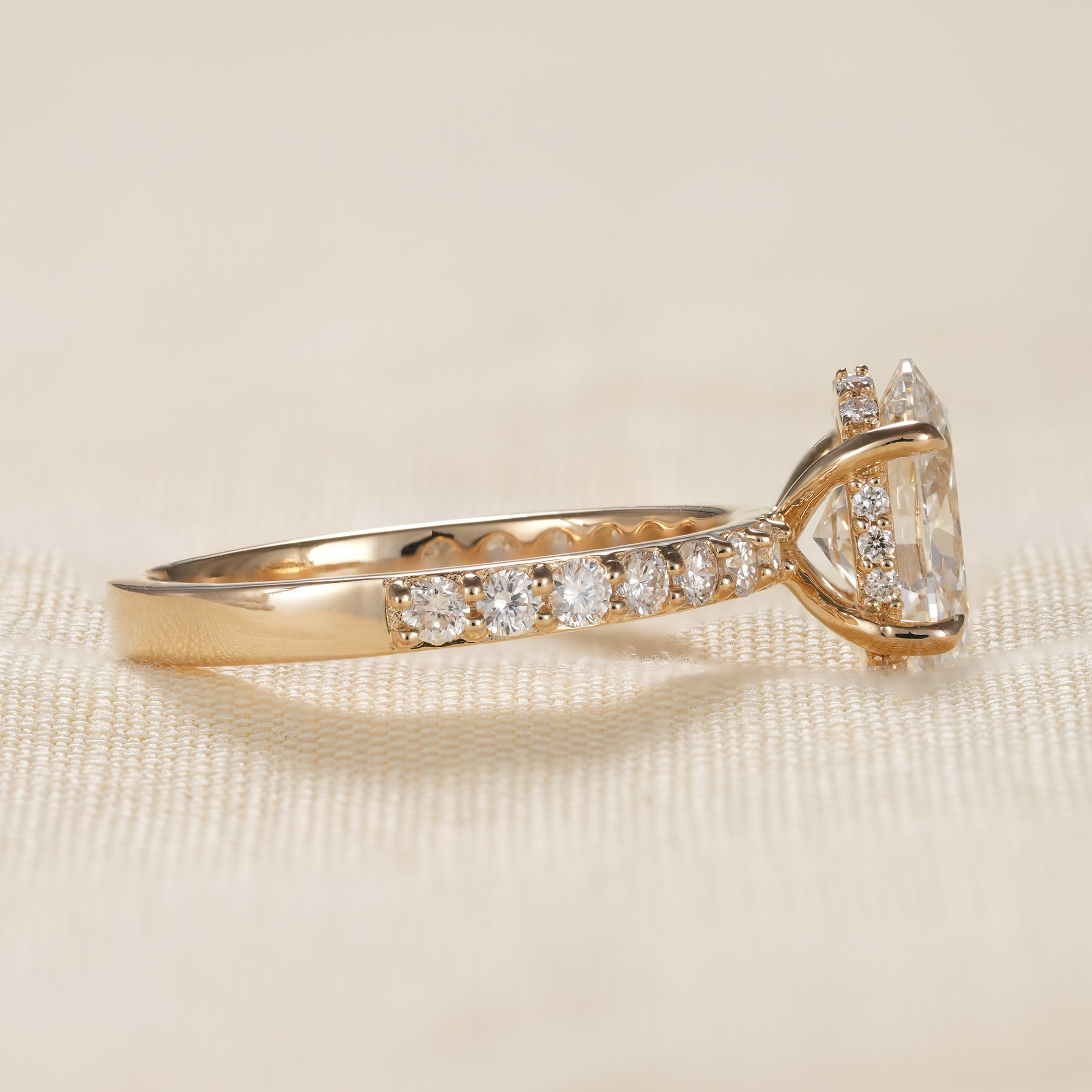 Elegant oval diamond ring with hidden halo setting in yellow gold
