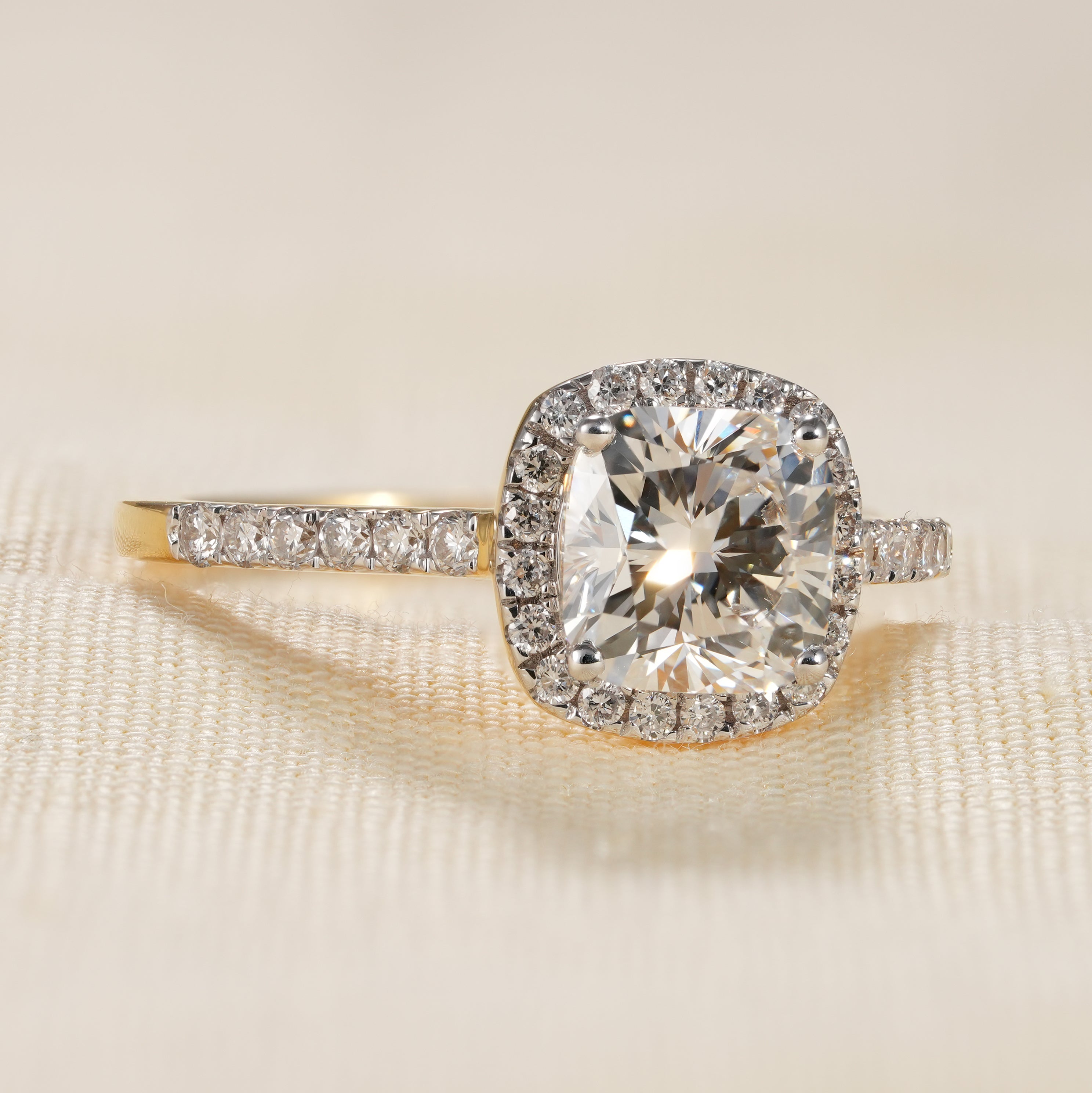 Cushion halo lab grown diamond ring with slim pavé yellow gold band