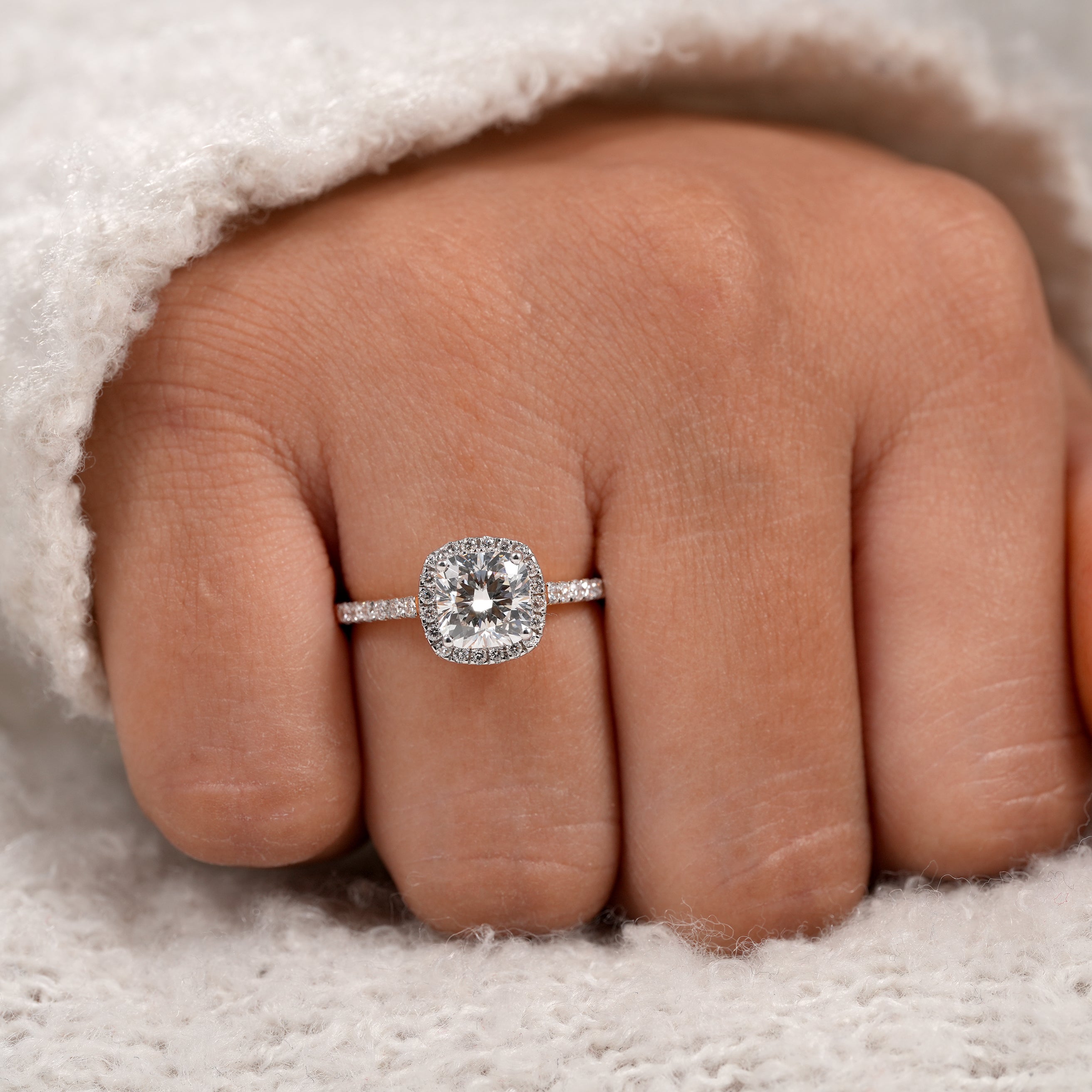 Minimalist yellow gold engagement ring with cushion halo diamond design