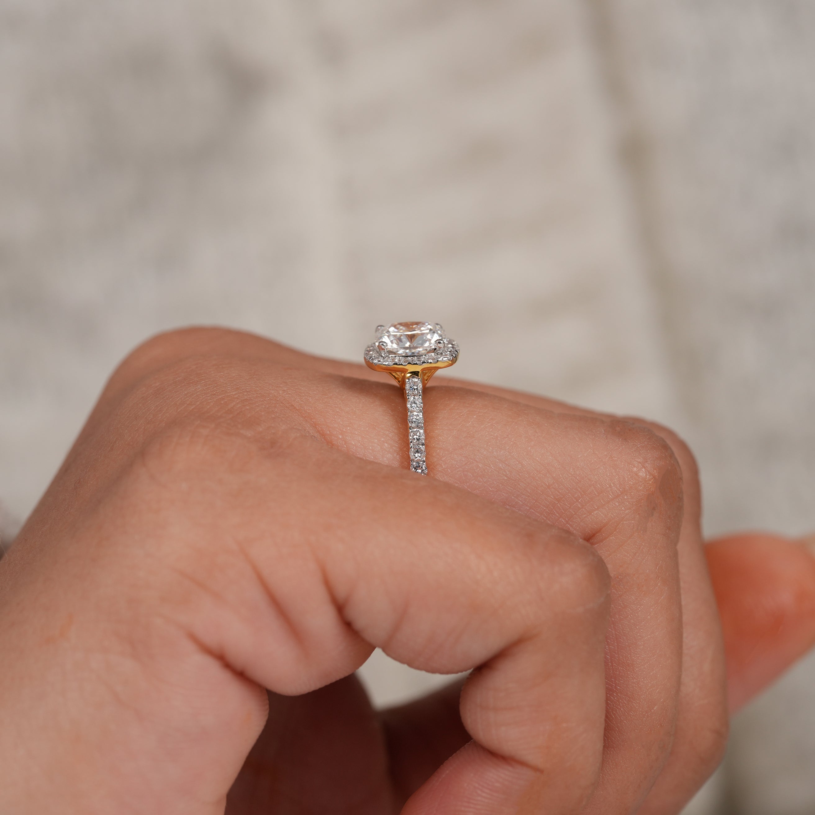 Cushion cut bridal ring with pavé band and hidden halo brilliance