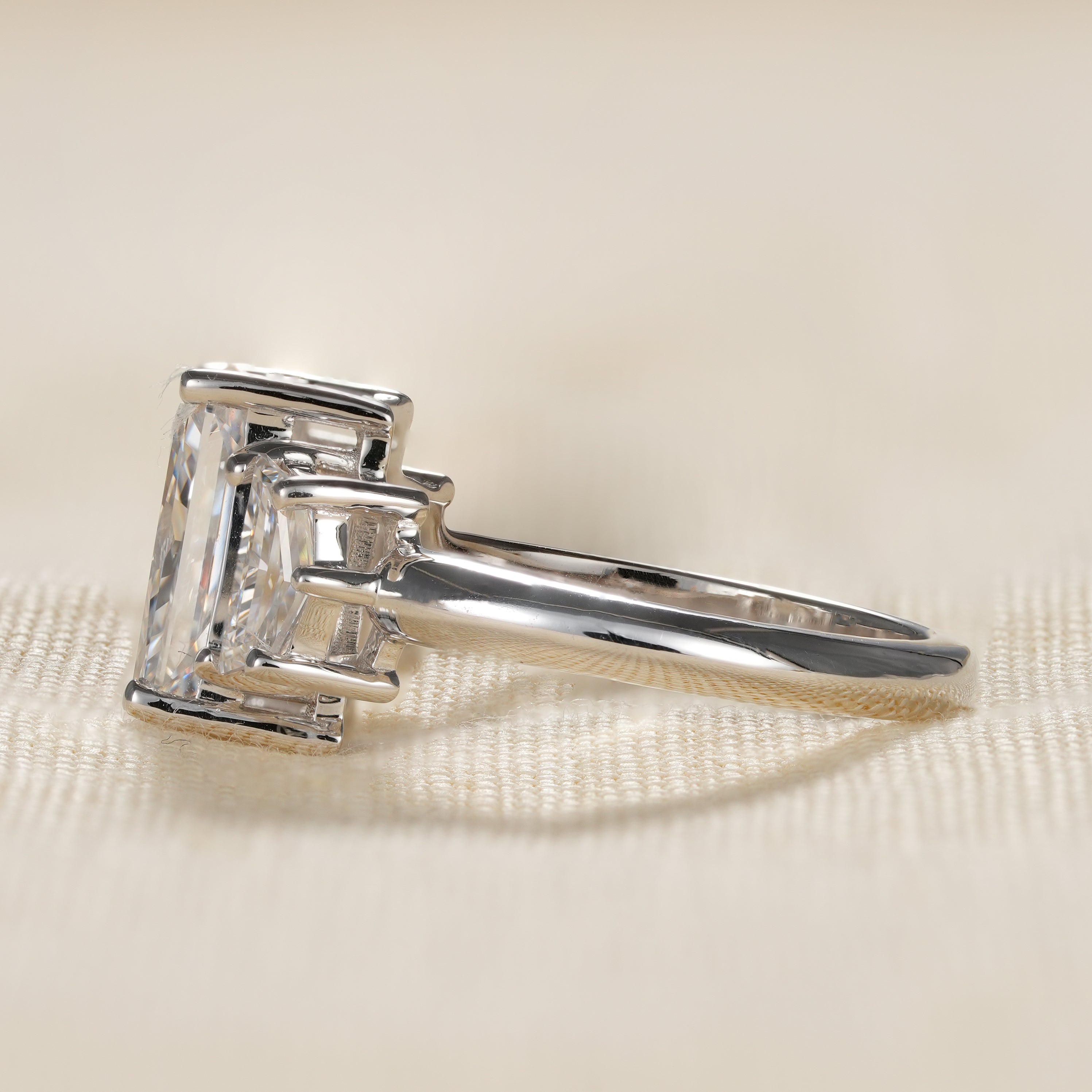 Classic lab diamond engagement ring with radiant cut center stone and Cadillac side stones