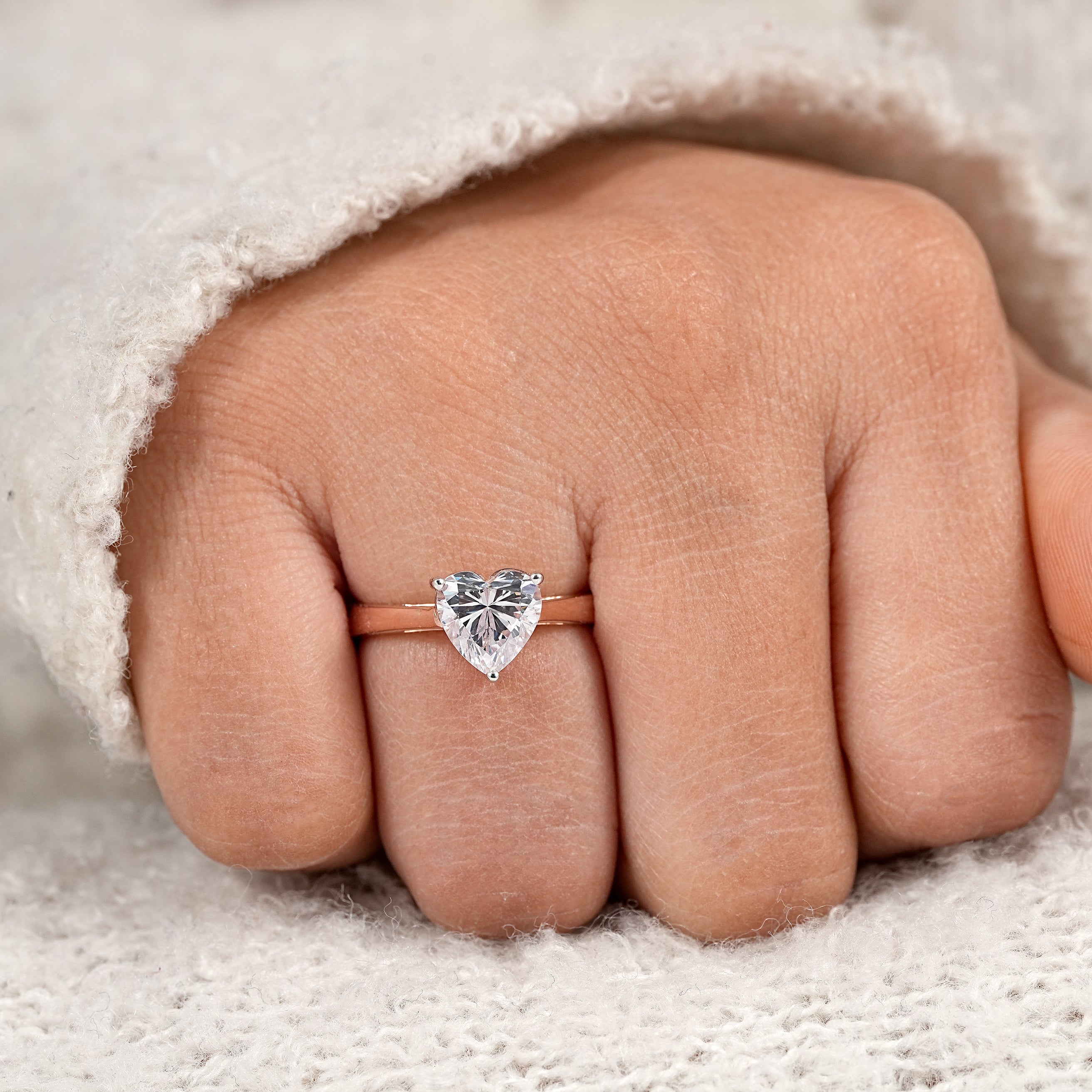 Elegant rose gold heart shaped engagement ring with sparkling solitaire stone