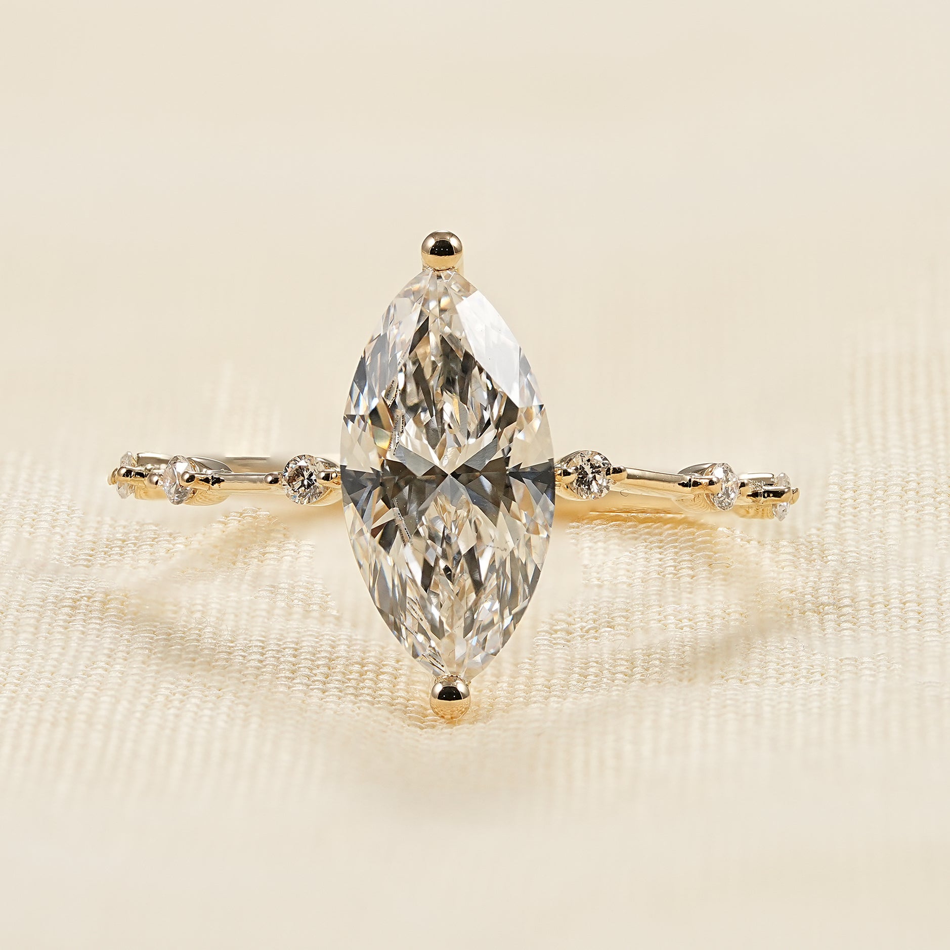 Minimalist marquise cut lab diamond engagement ring in yellow gold