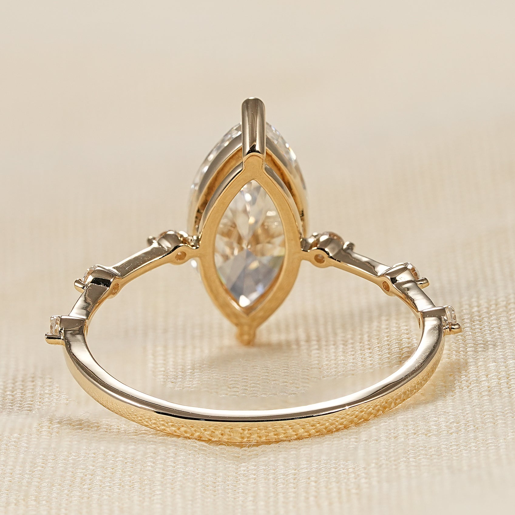 Modern marquise lab diamond ring with minimalist gold band and sparkle accents