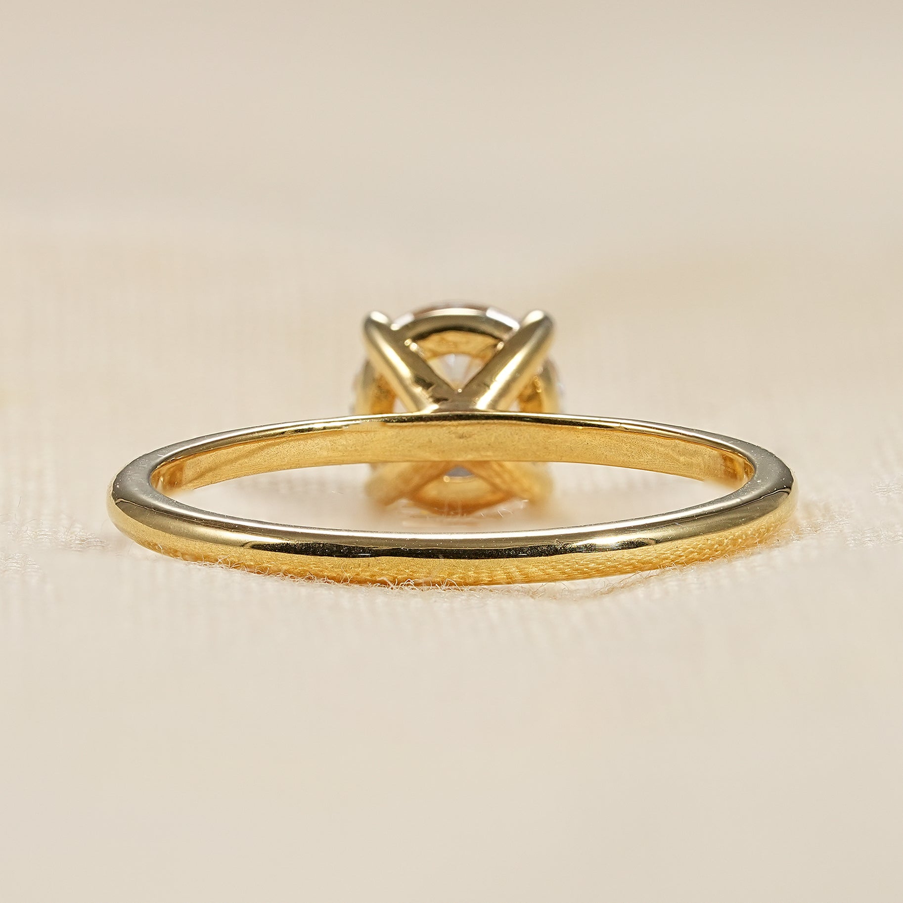 Simple yellow gold solitaire ring with sparkling round lab diamond