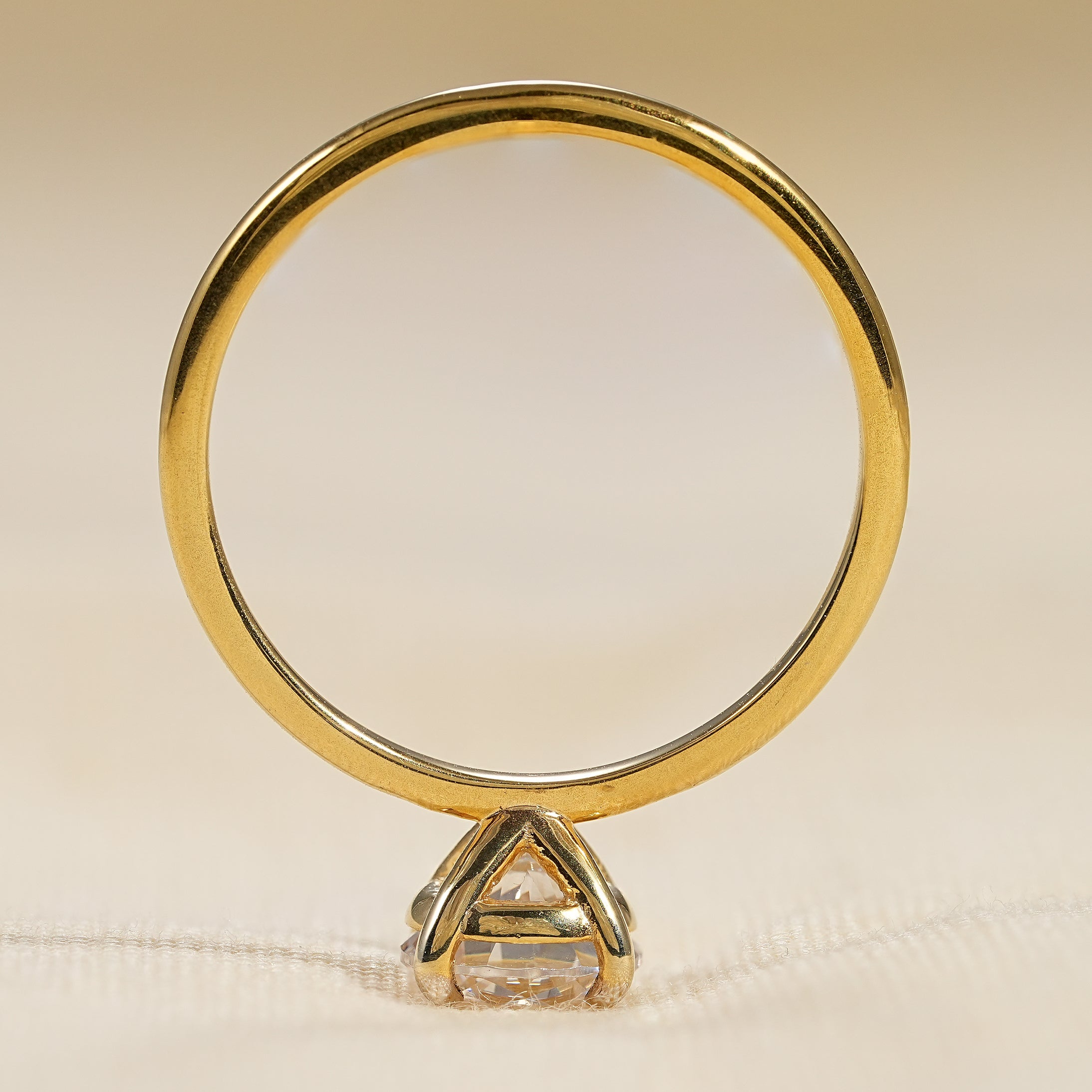 Classic round cut engagement ring with sleek minimalist gold band