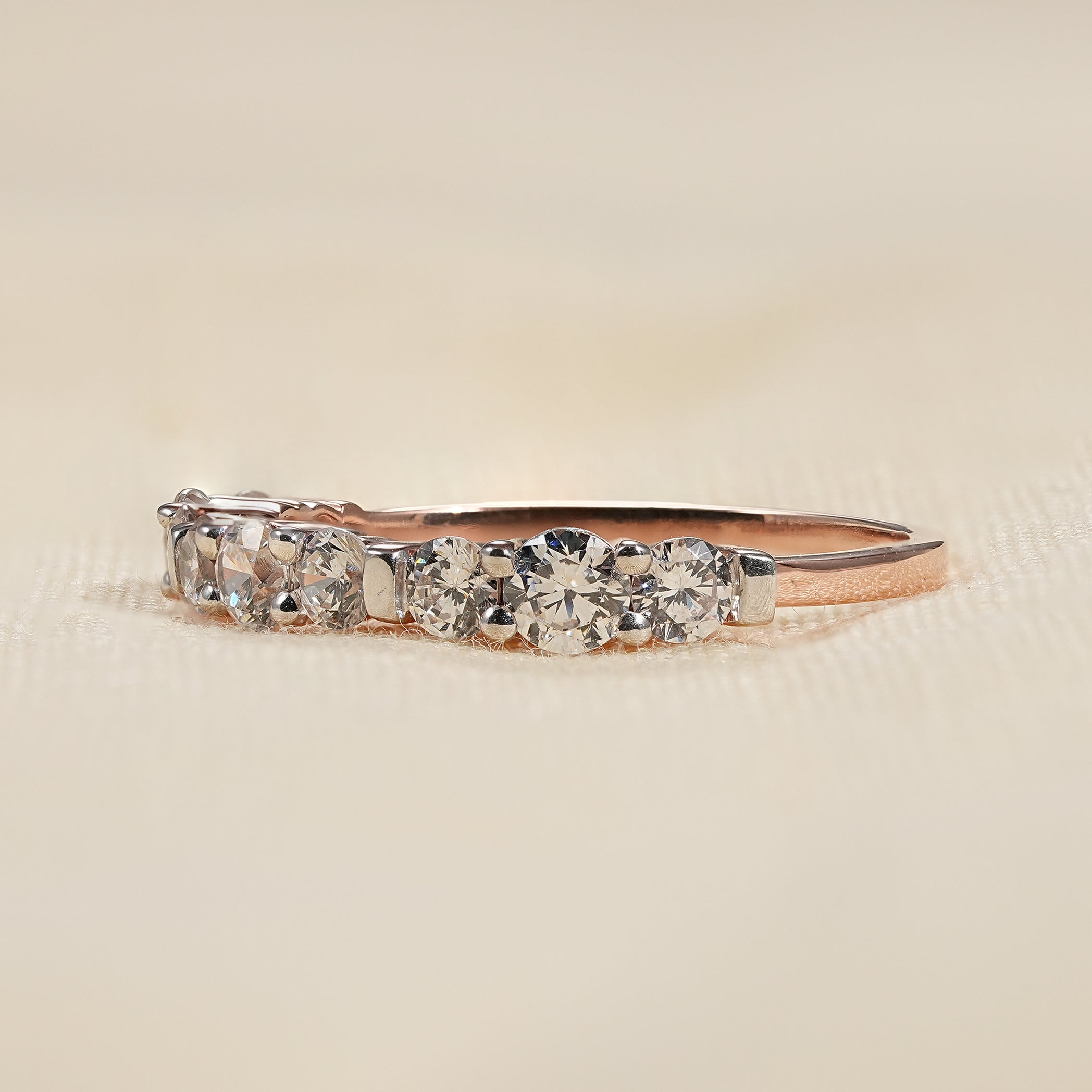 Shared prong diamond wedding band with sleek minimalist silhouette
