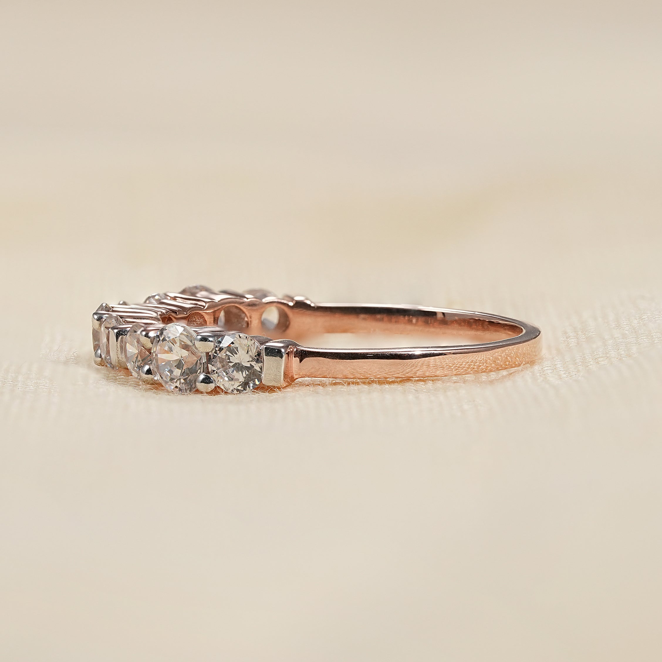 Dainty eternity band with round lab grown diamonds and bar setting