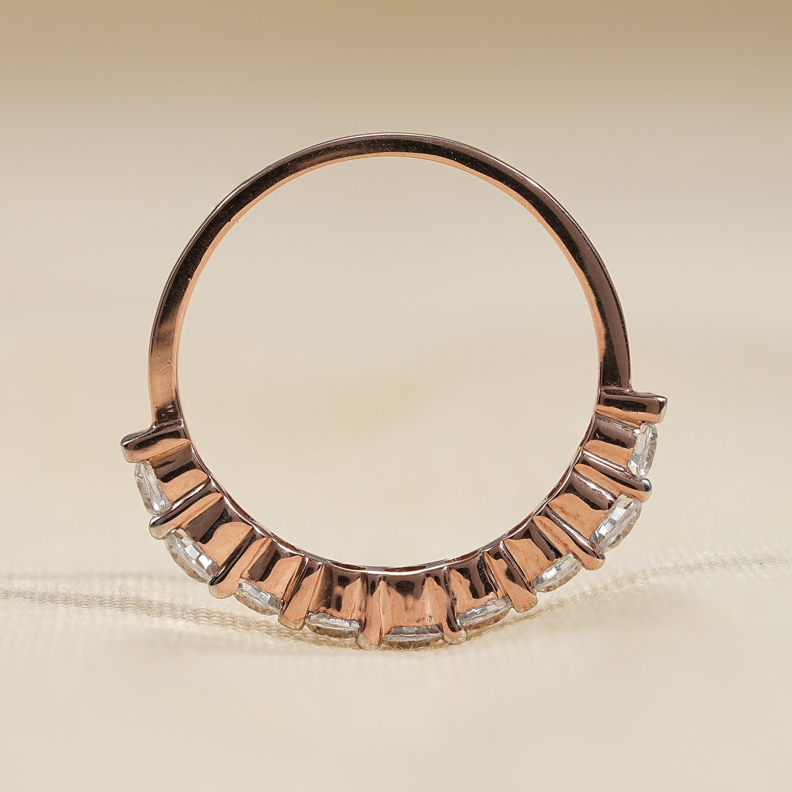 Rose gold diamond stacking ring with shared prong eternity design