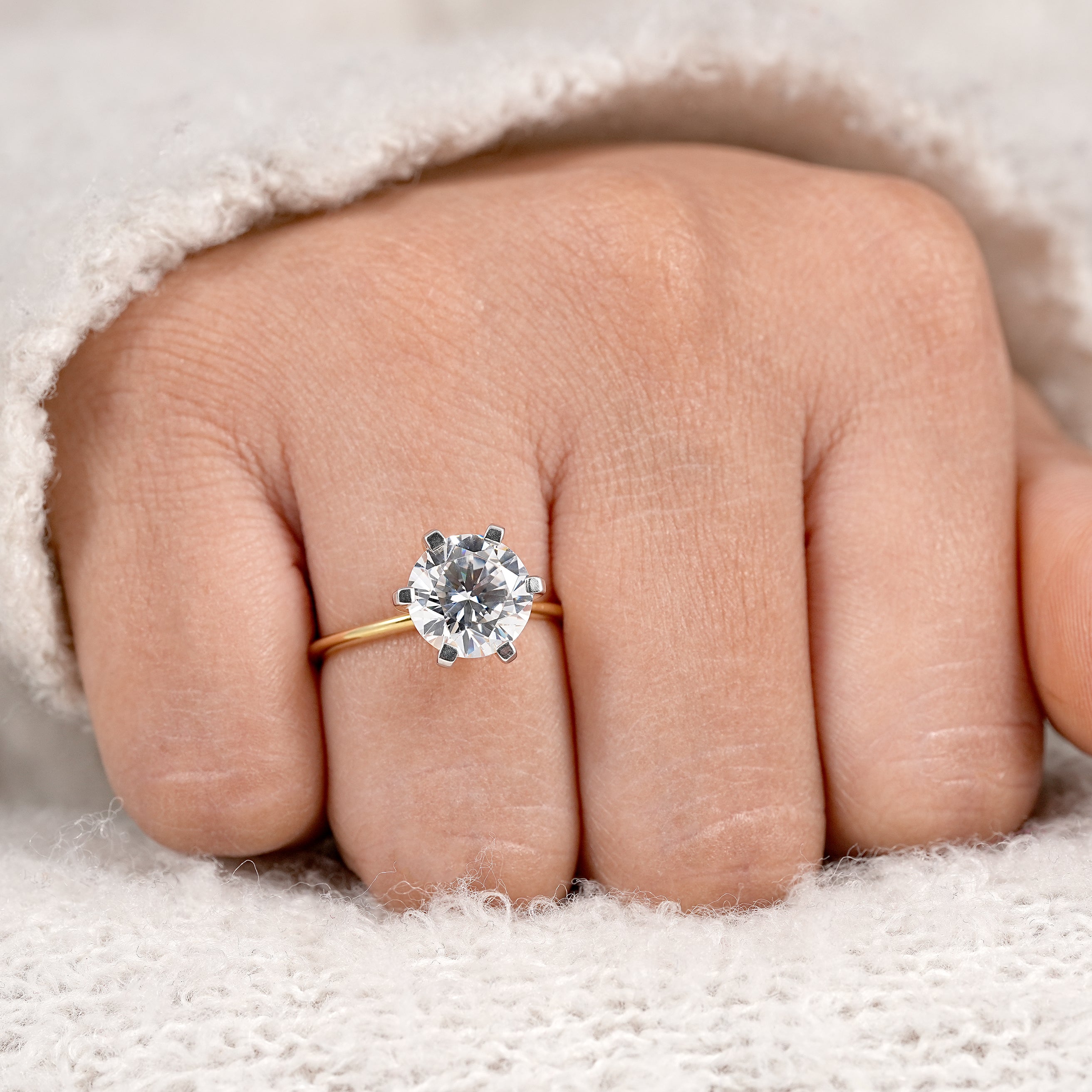 Classic bridal engagement ring with round solitaire diamond and slim gold band