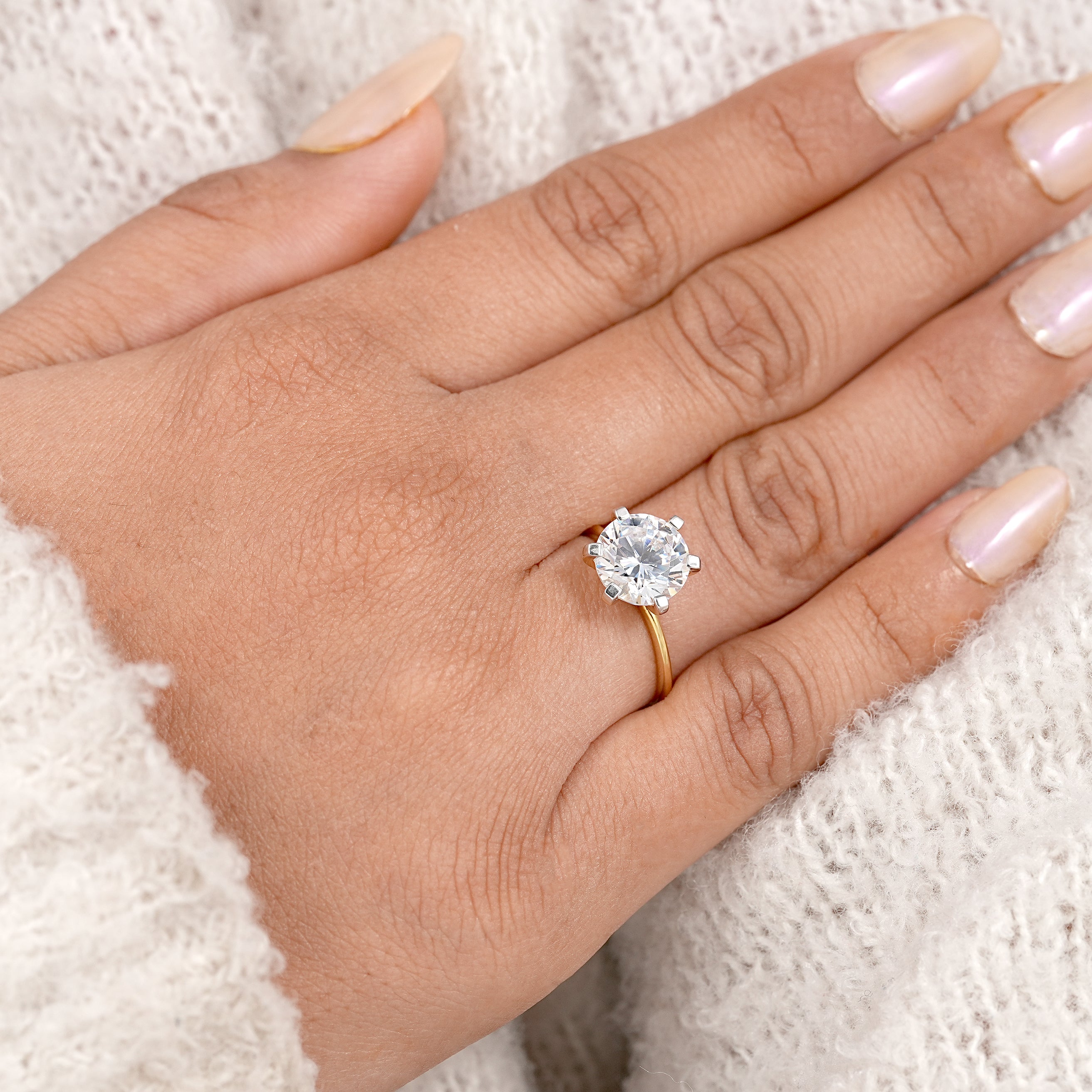 Dainty yellow gold solitaire ring featuring brilliant round cut lab diamond