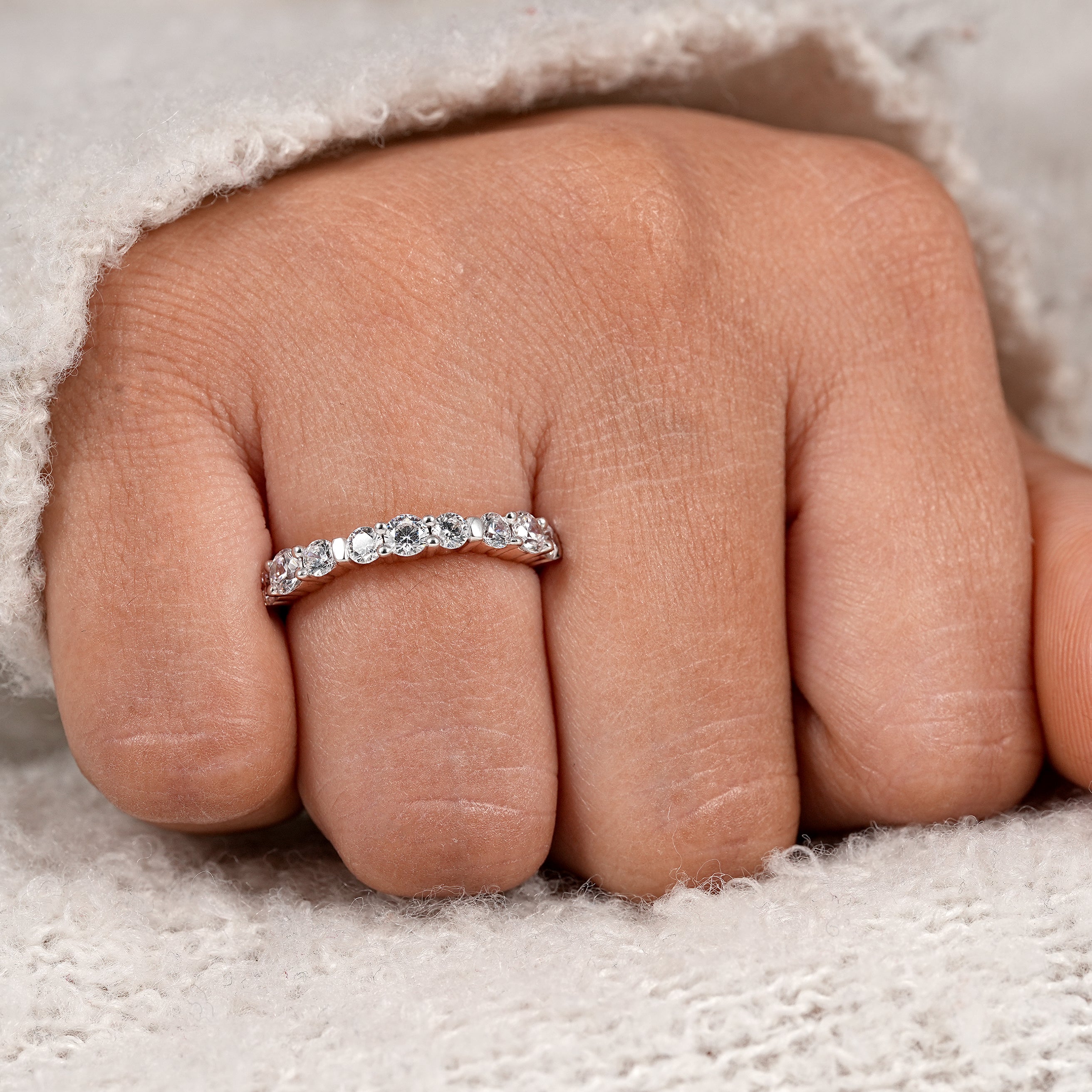 Minimalist eternity ring with round cut diamonds for stacking and bridal wear