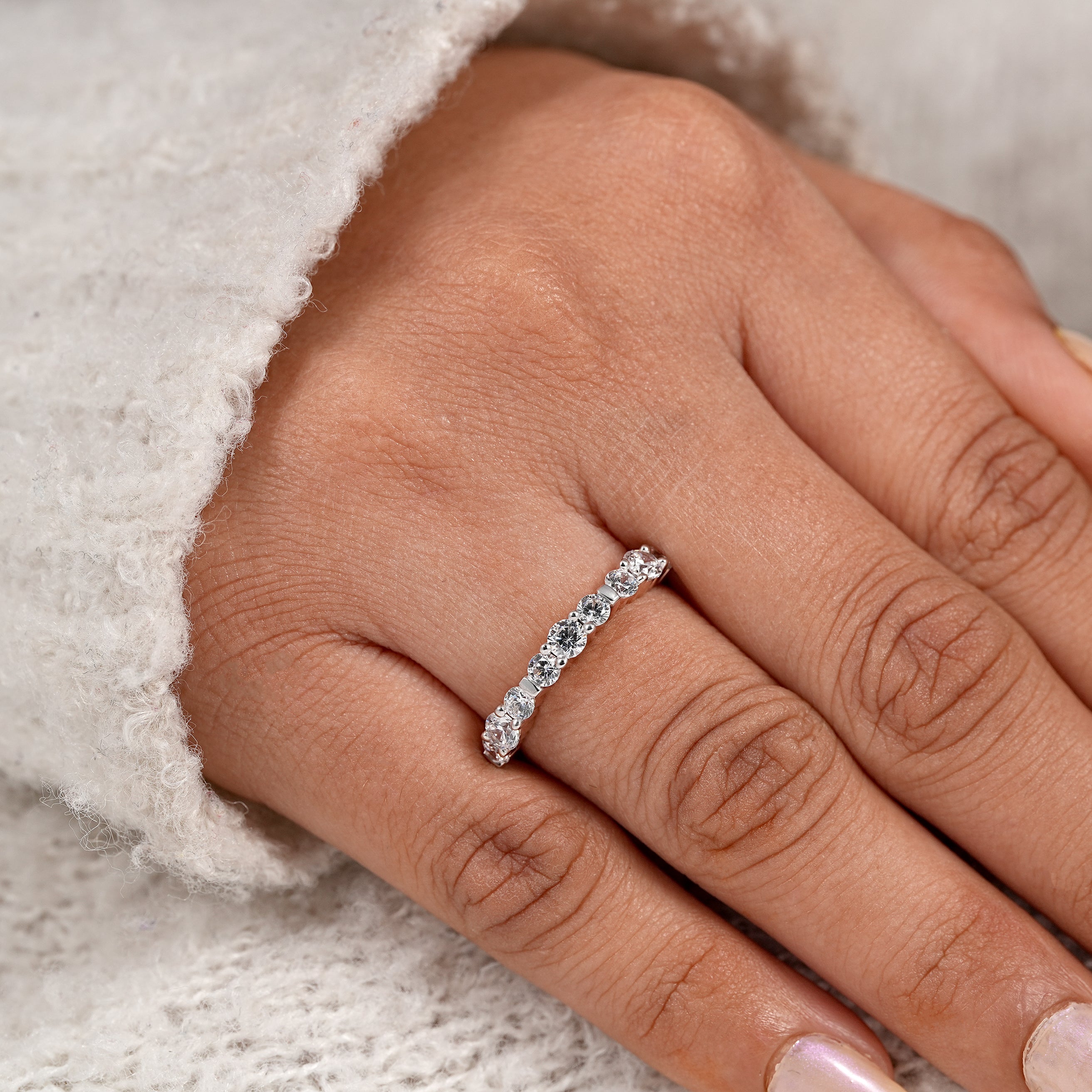 Timeless diamond anniversary band with shared prong and bar setting details