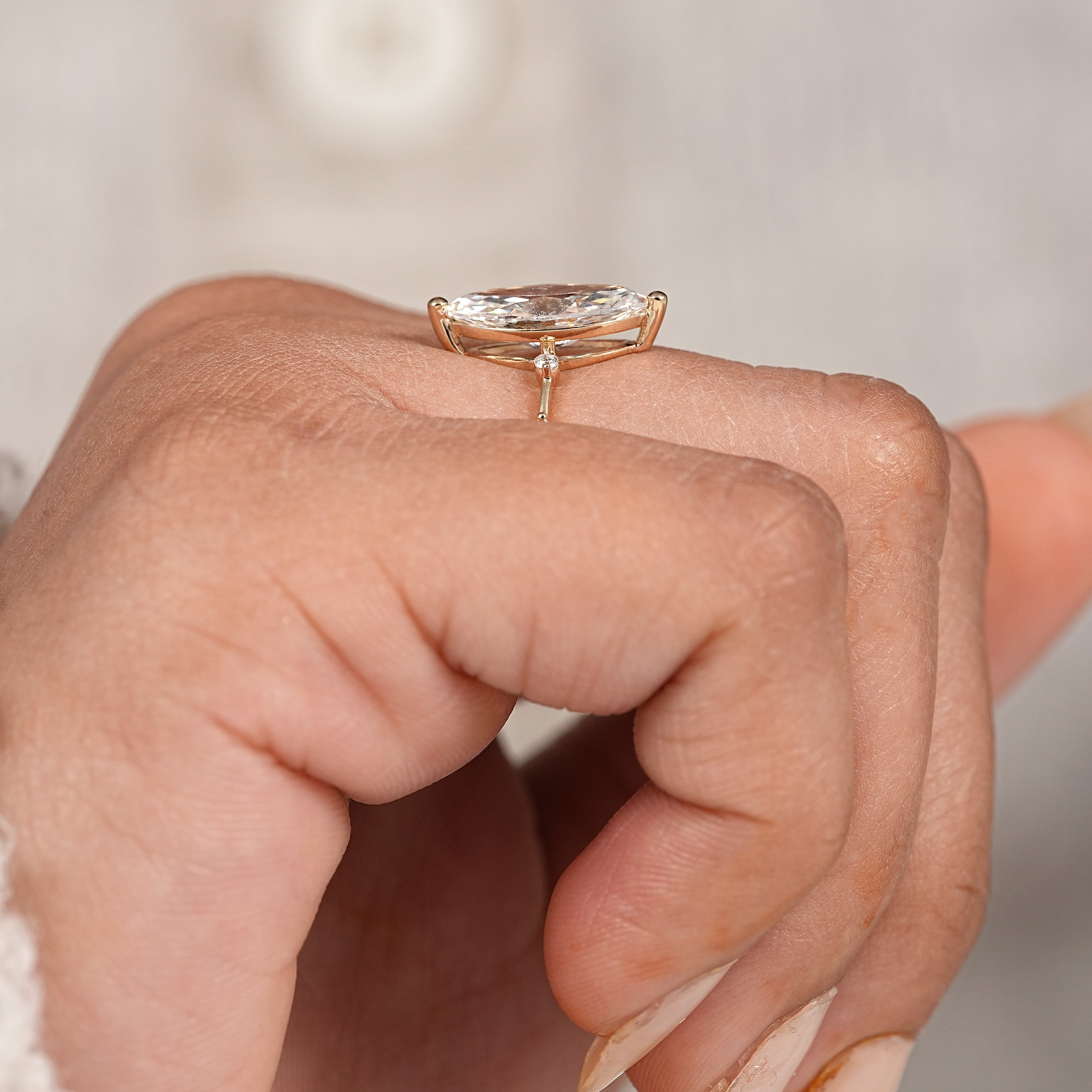 Luxury marquise lab diamond ring with slim yellow gold band and accent stones